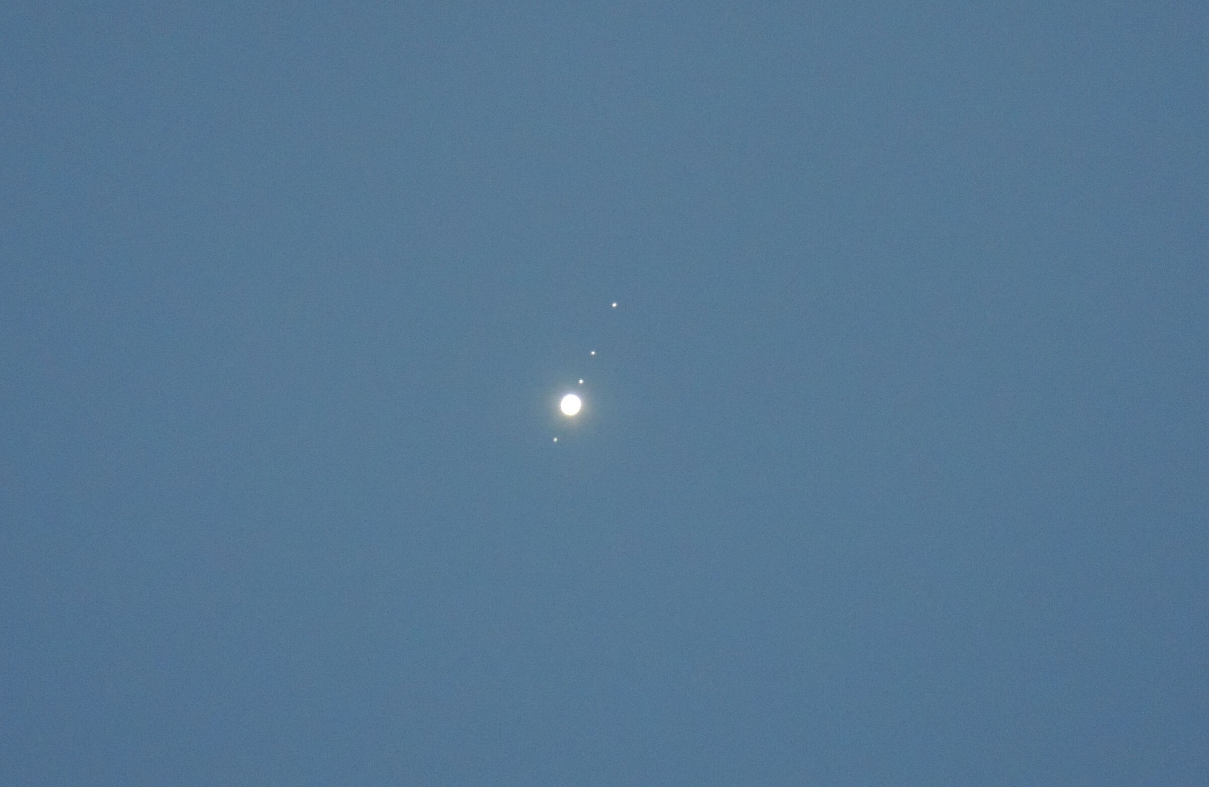 Jupiter and four moons.