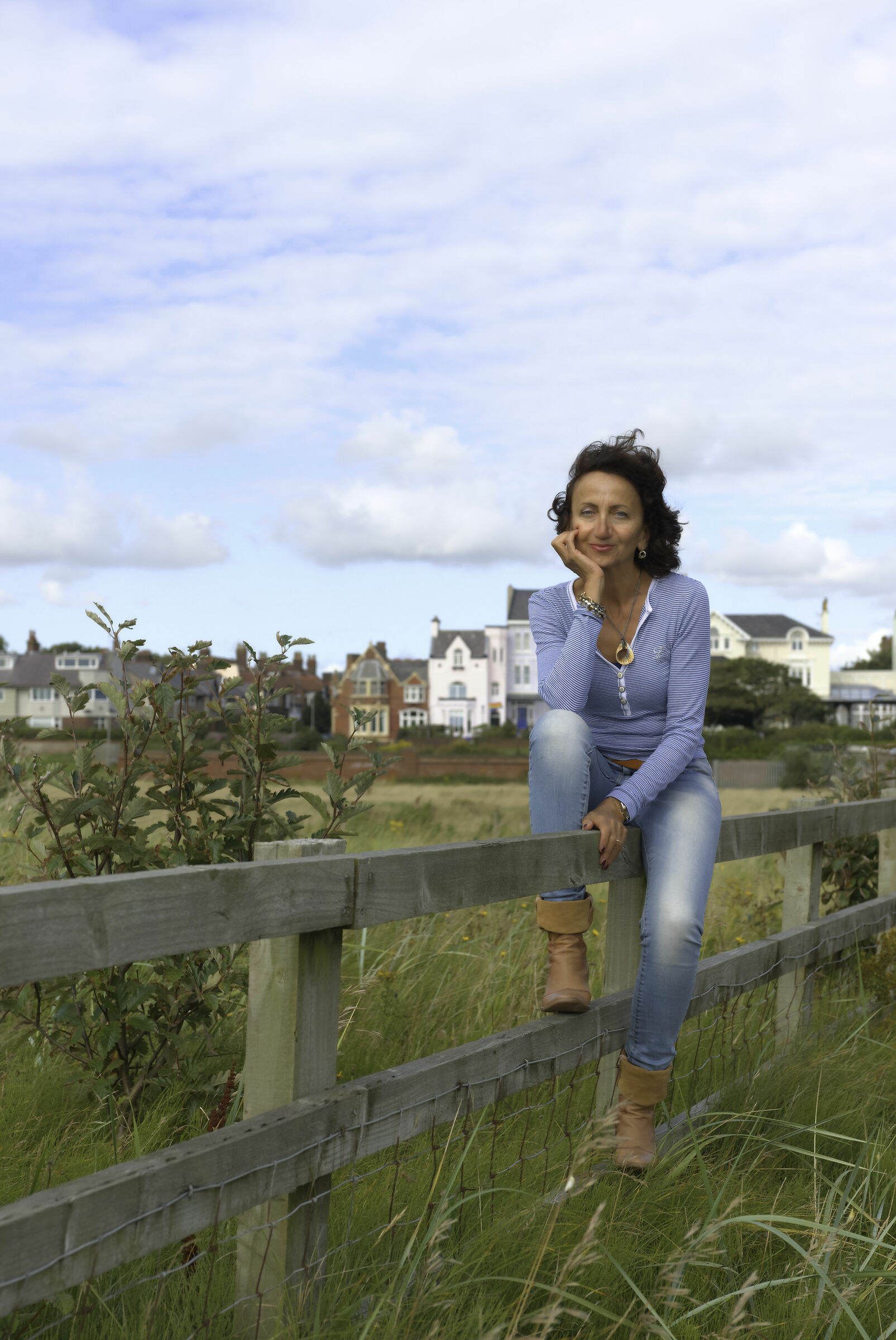 Portrait of a lady on a fence