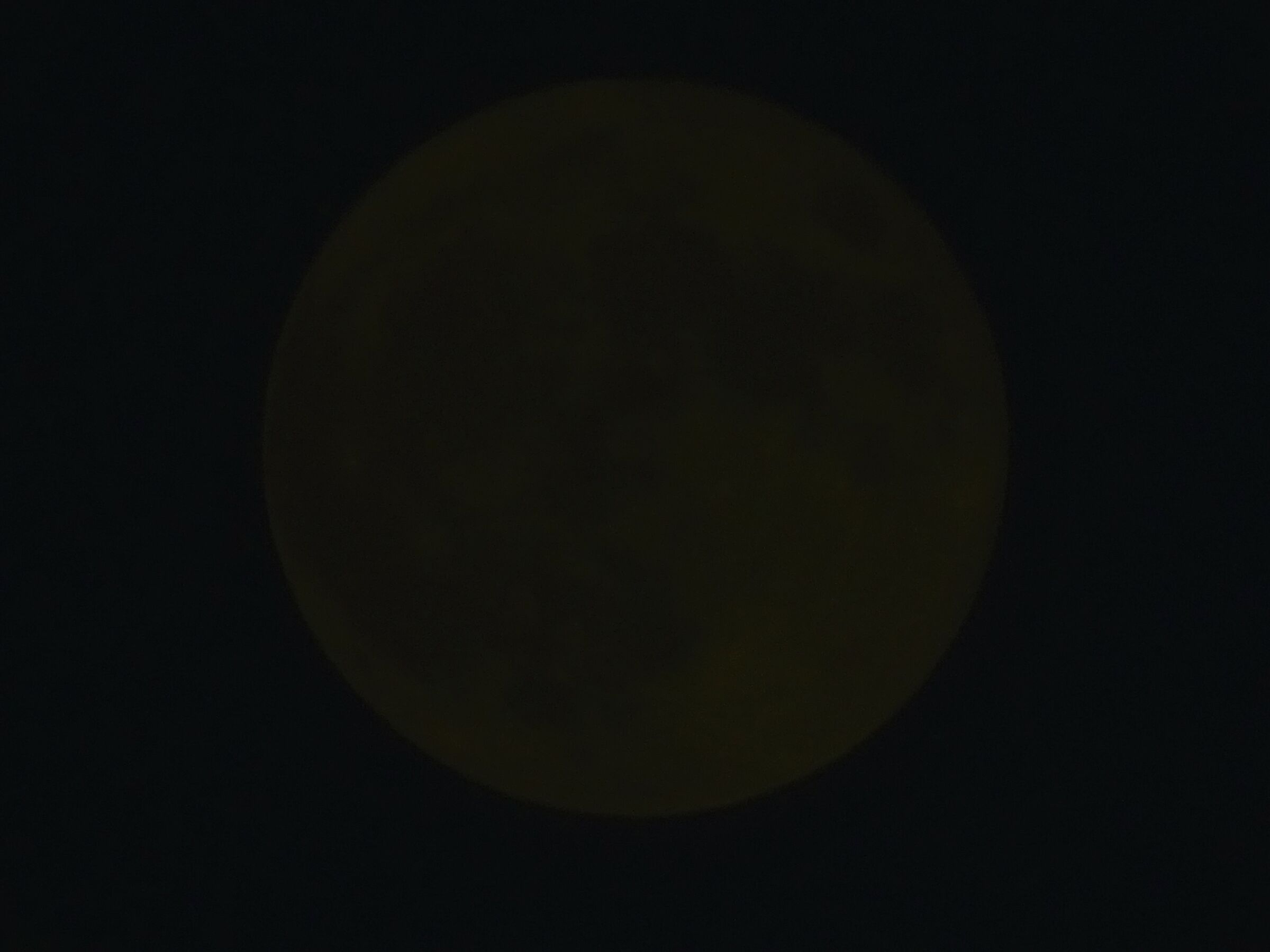 full moon in dim light