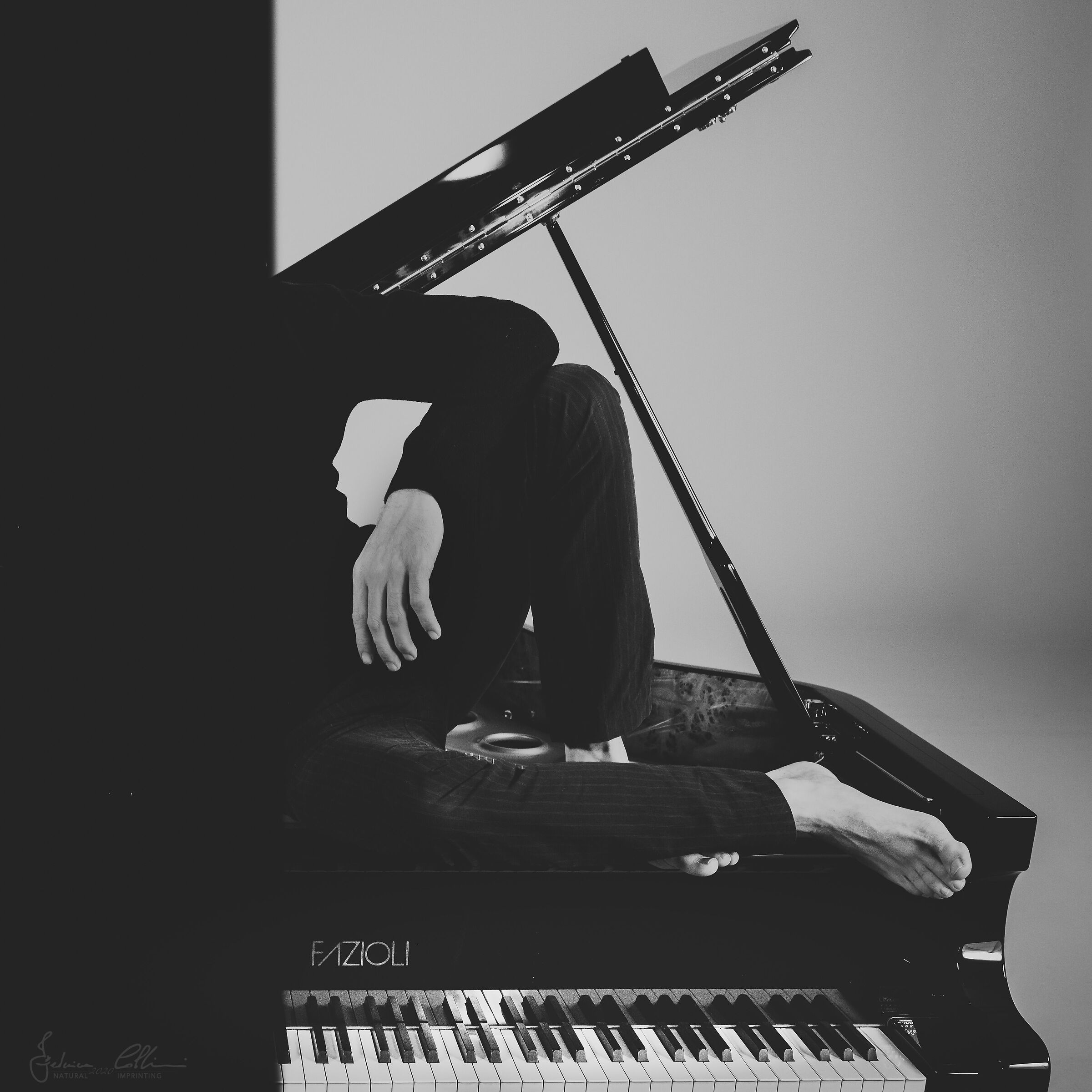 With hands and feet, like piano keys