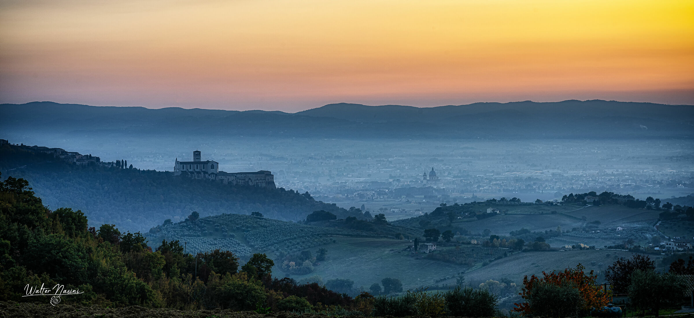 glimpse of an autumn sunset over the Assisi Valley