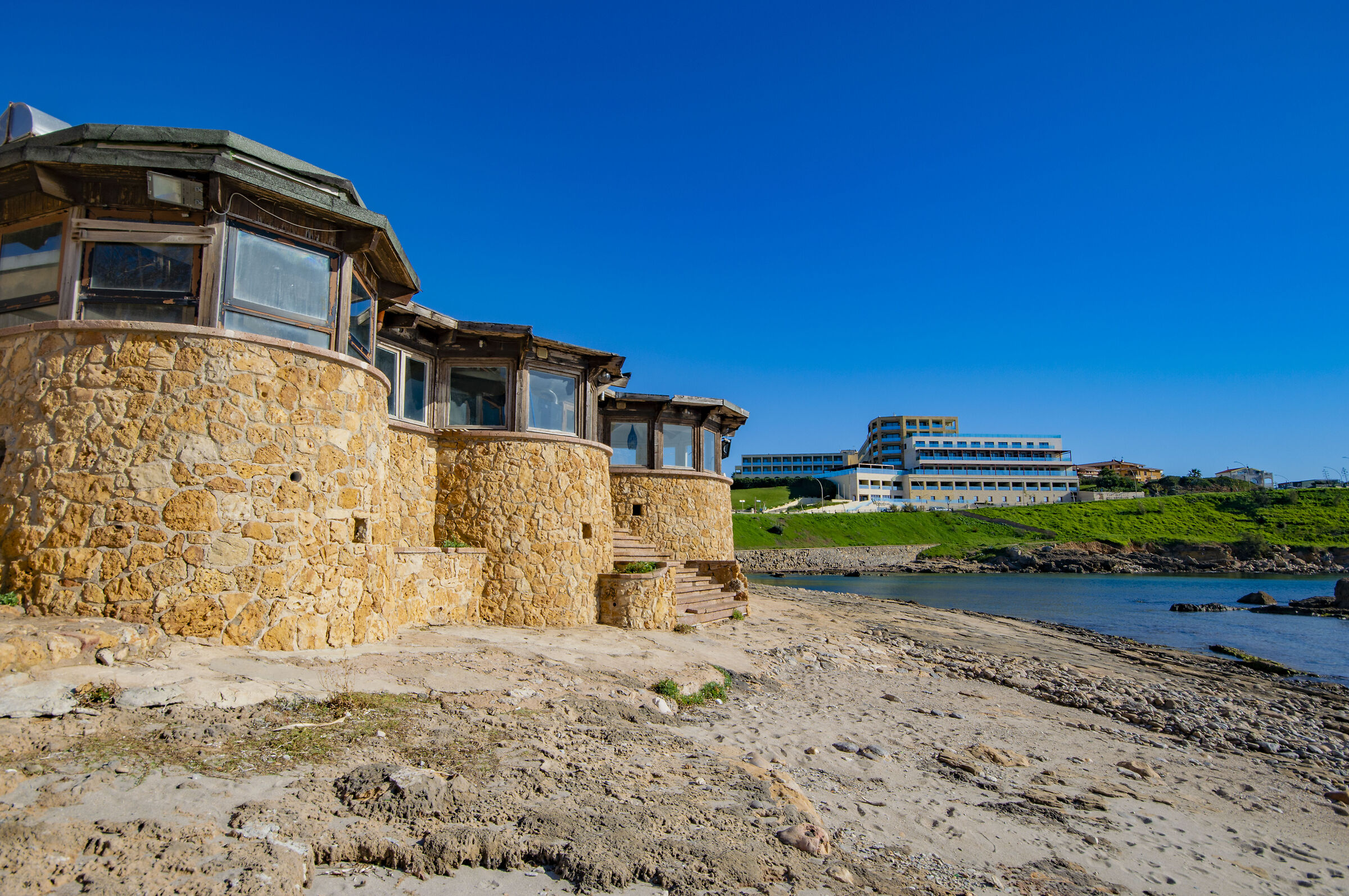 Alghero - El trò in the foreground with view of Hotel...