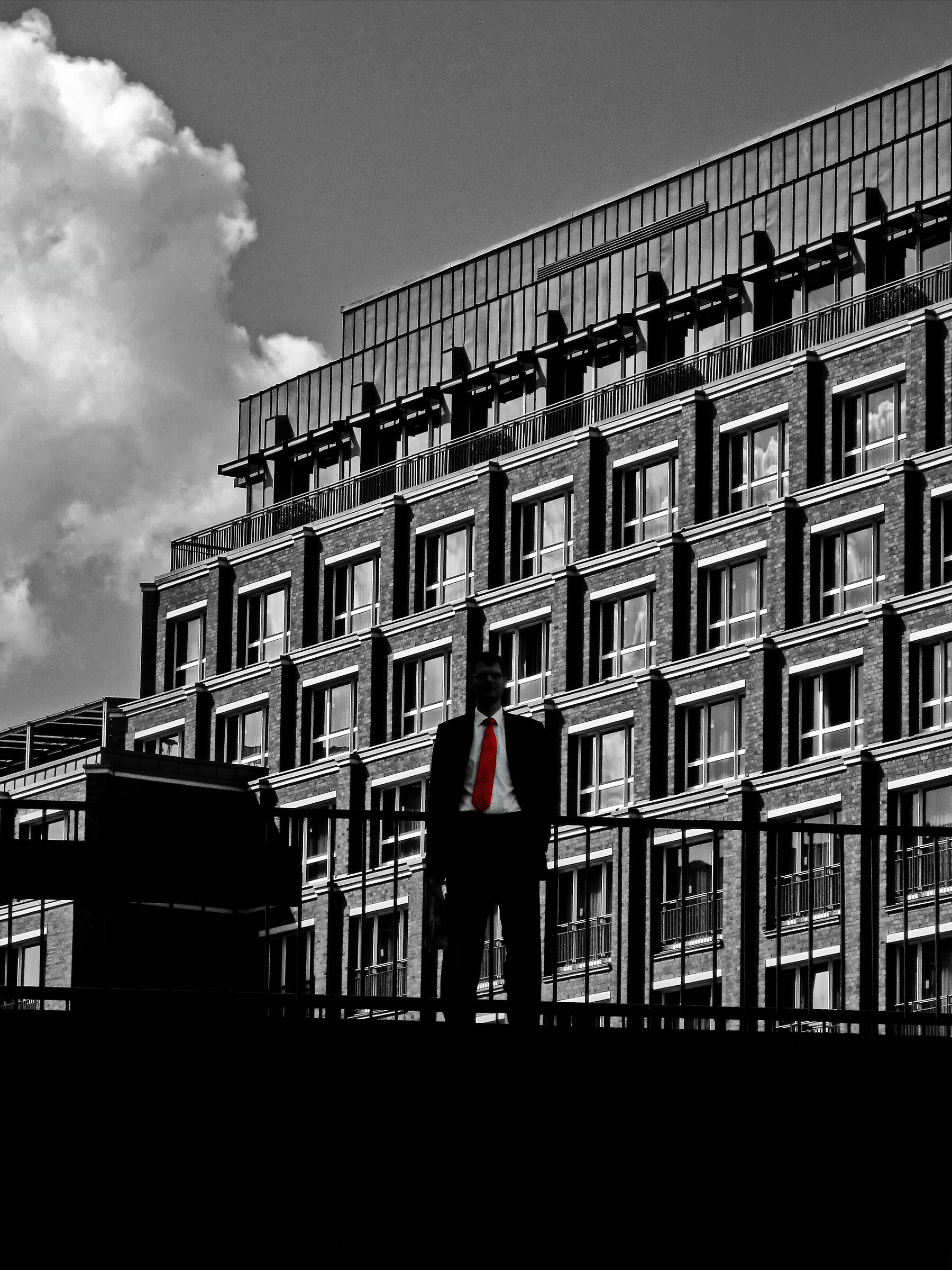 Man in black, white, red