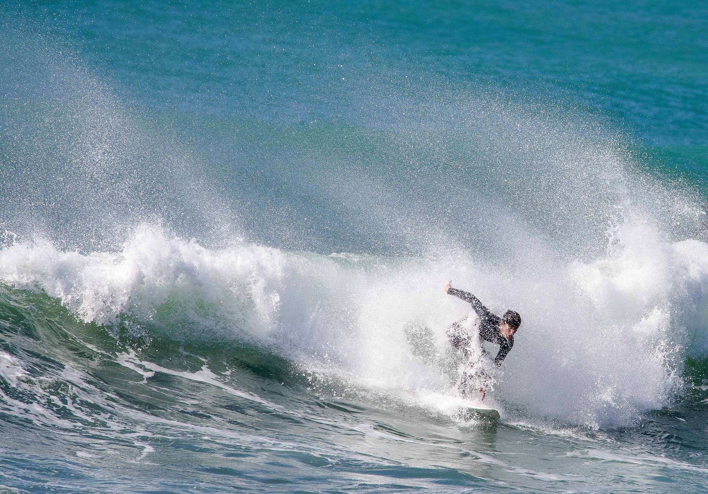 A guy while surfing - Levanto