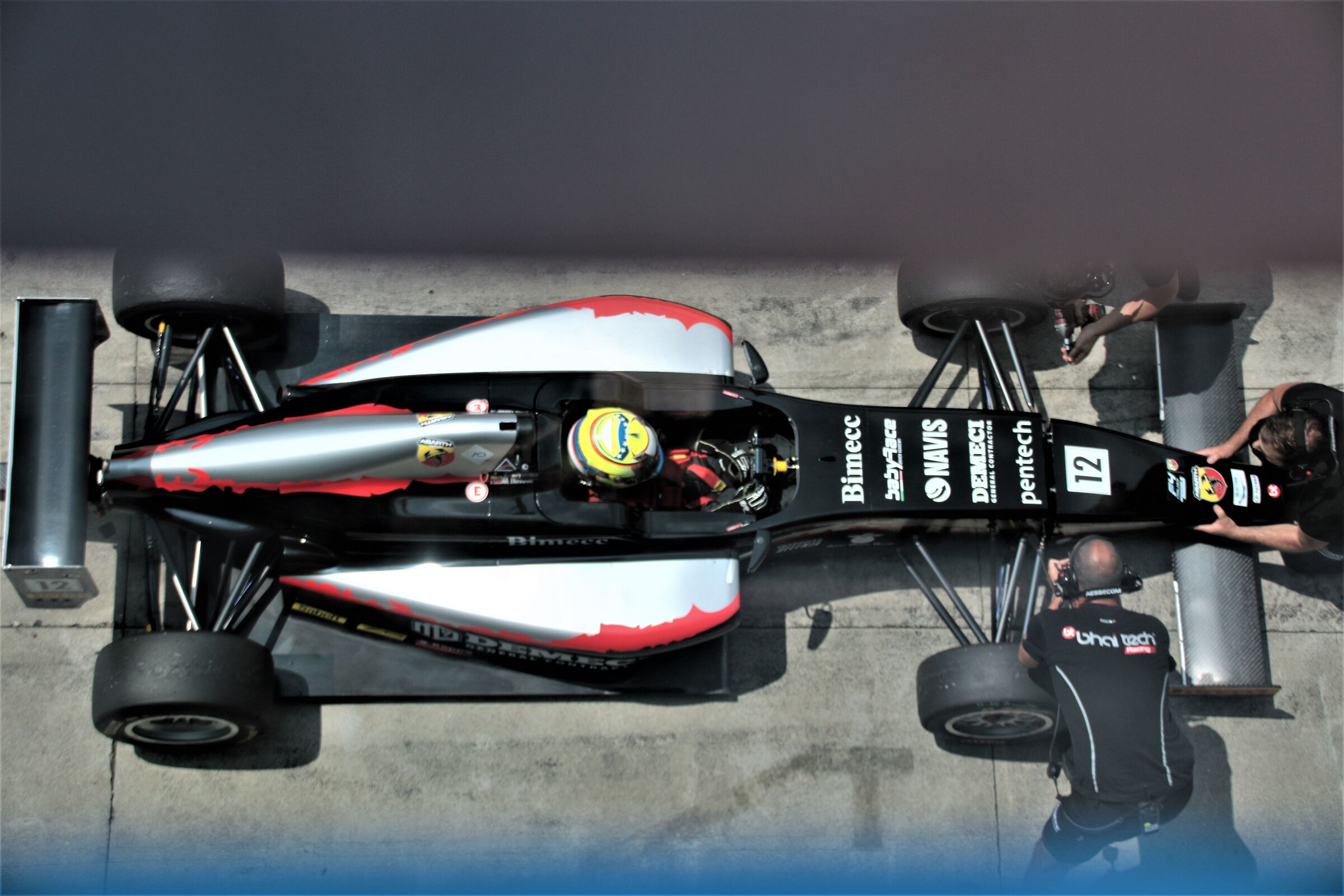 between the grill... above the pits