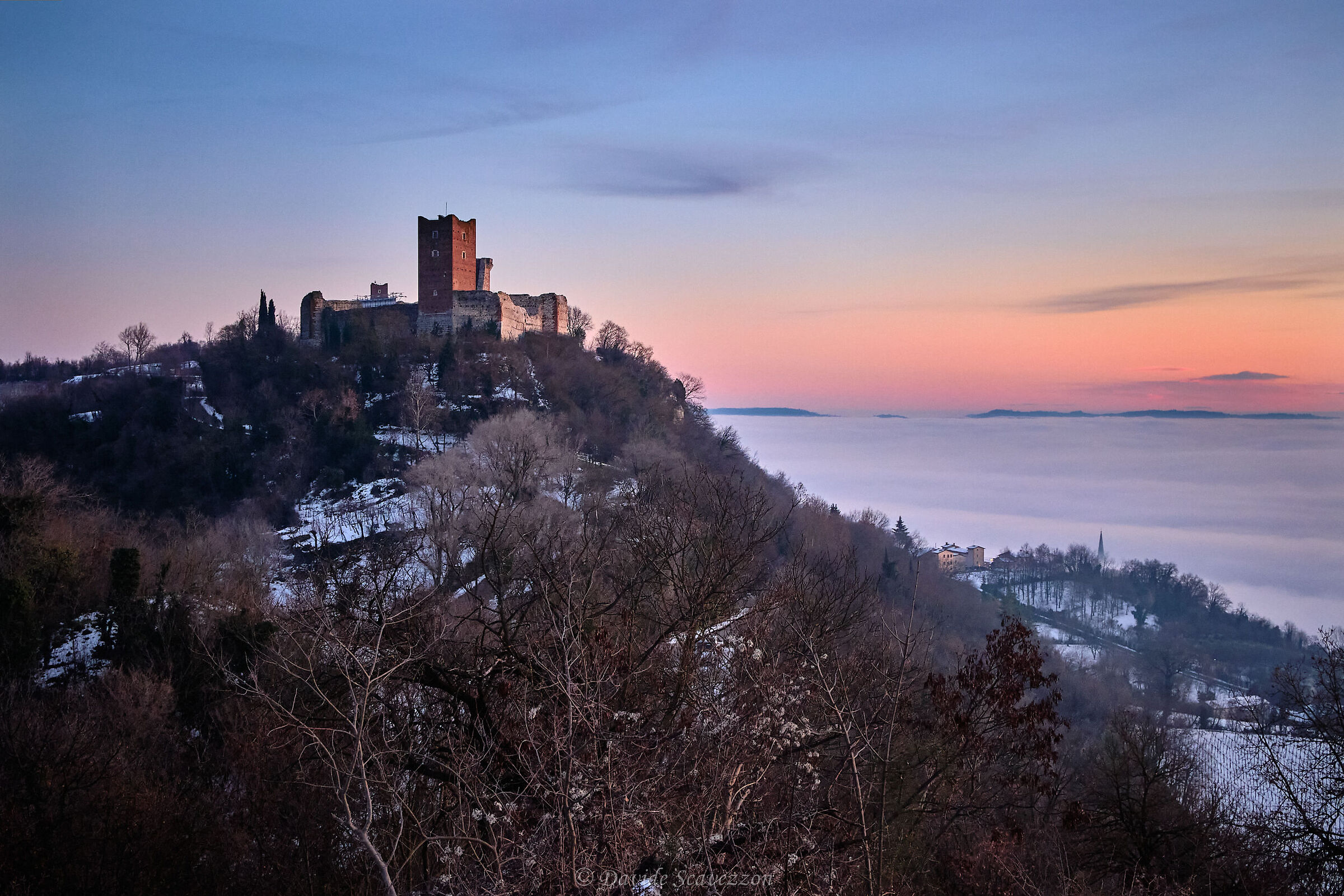 The castle towers over the mists