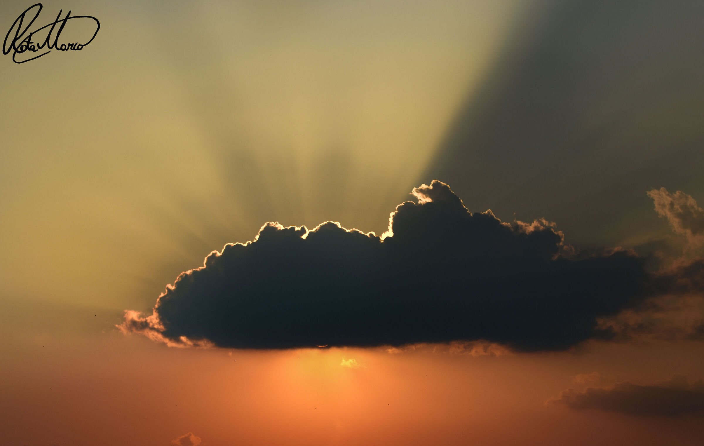 A small cloud covering the sun