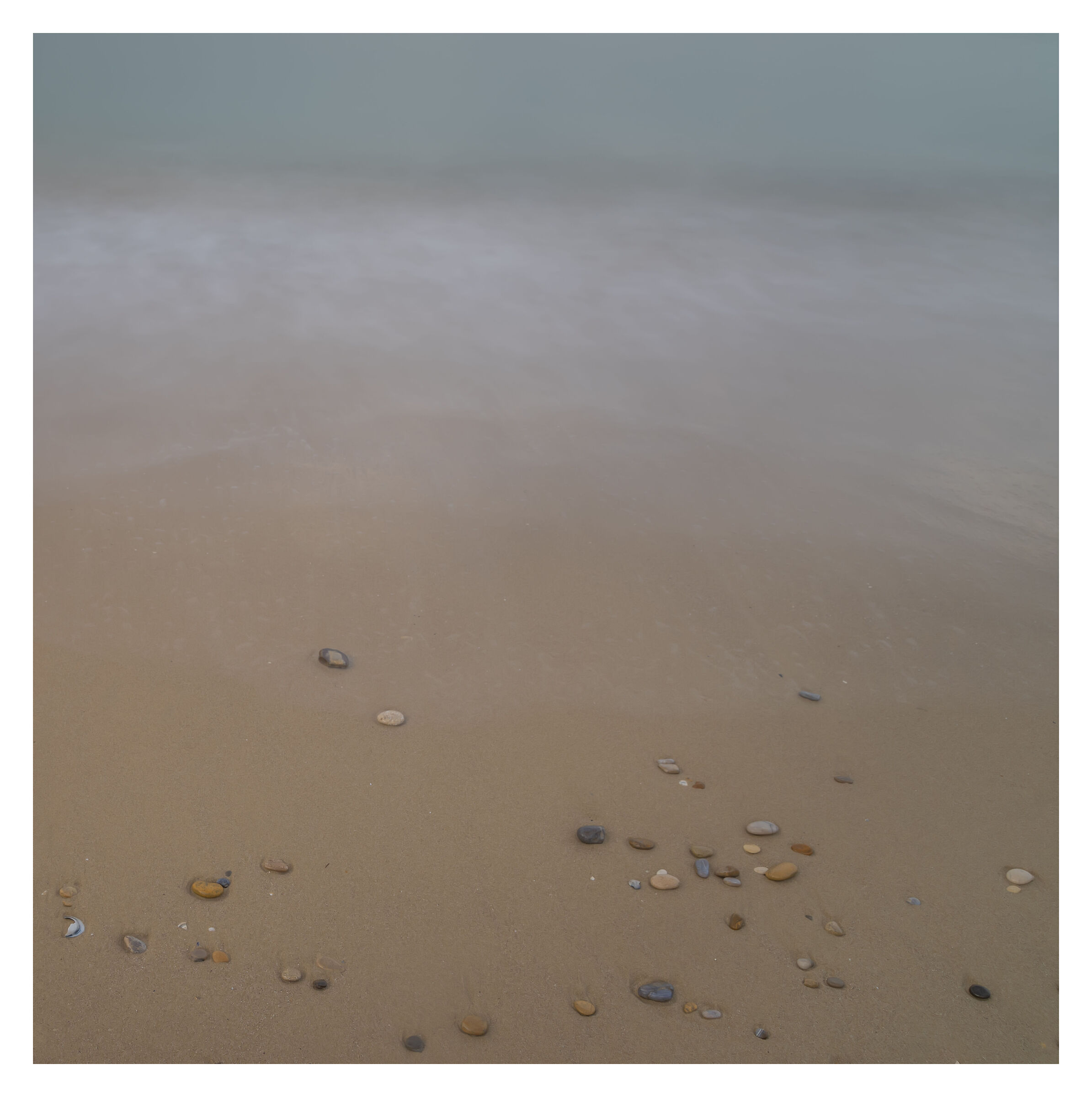 Pebbles, sand and sea