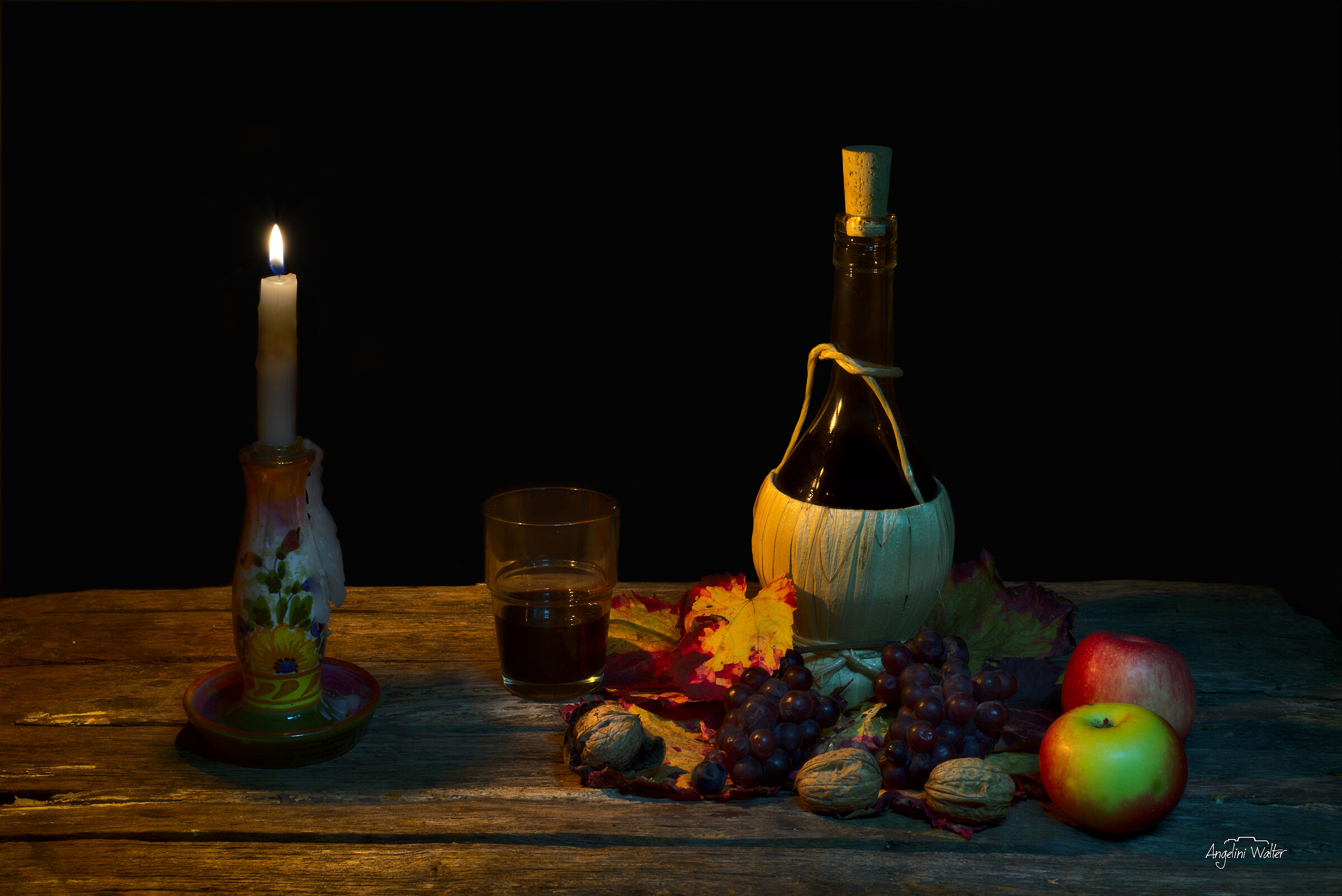 Still Life candela e vino cotto.