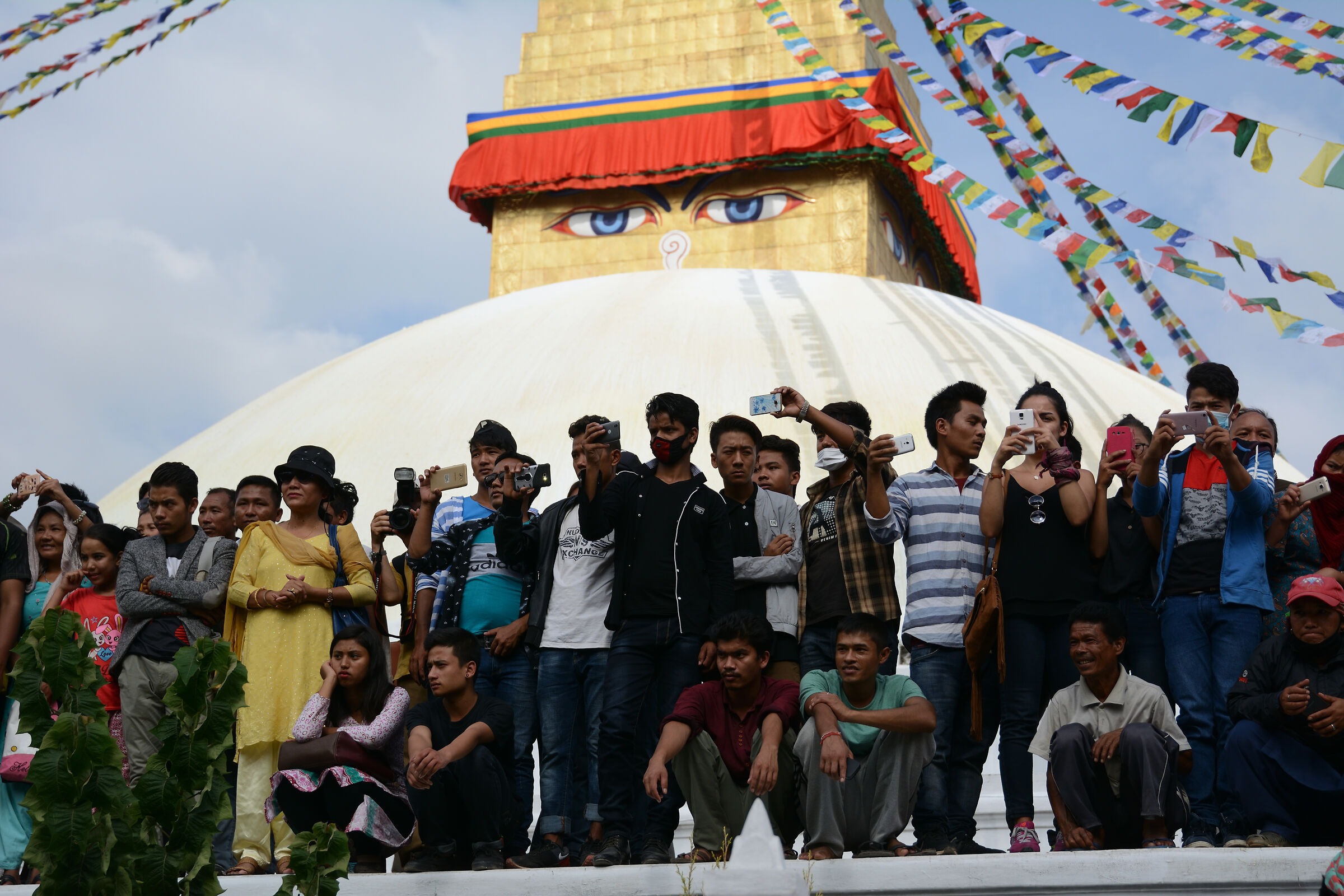 Tourists at boudhanath stupa, Buddhist temple