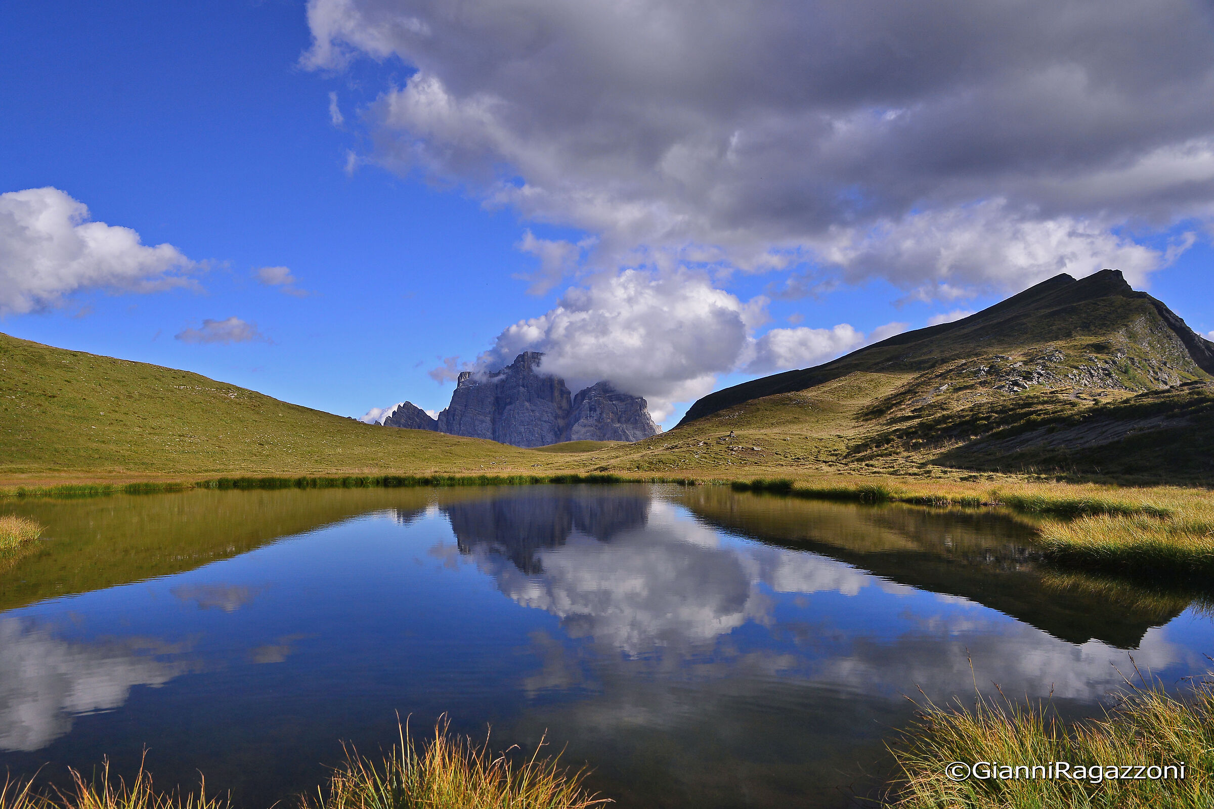 Mount Pelmo is reflected in Lake Delle Baste