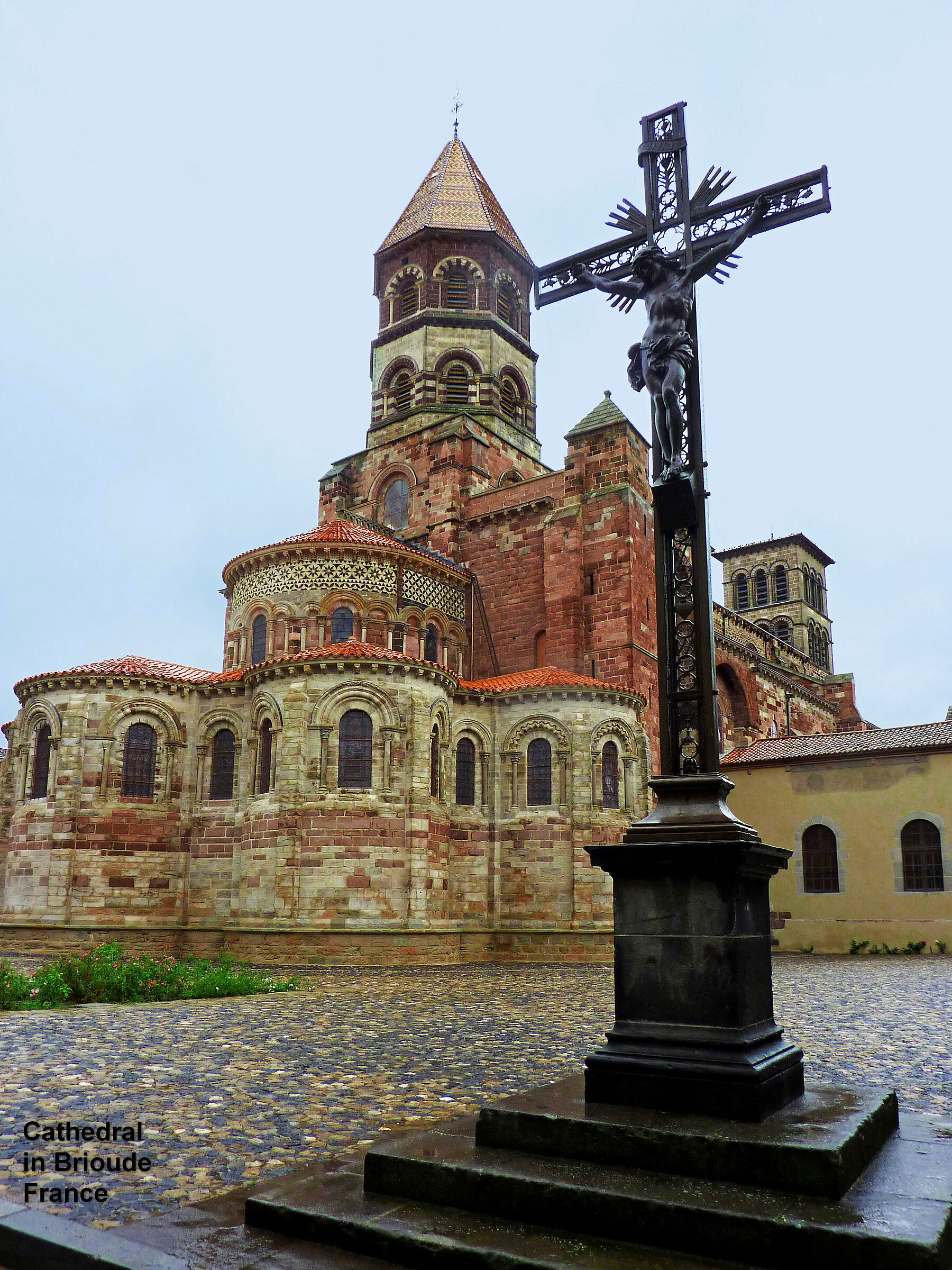 The cathedral of Brioude on a gray and rainy summer day