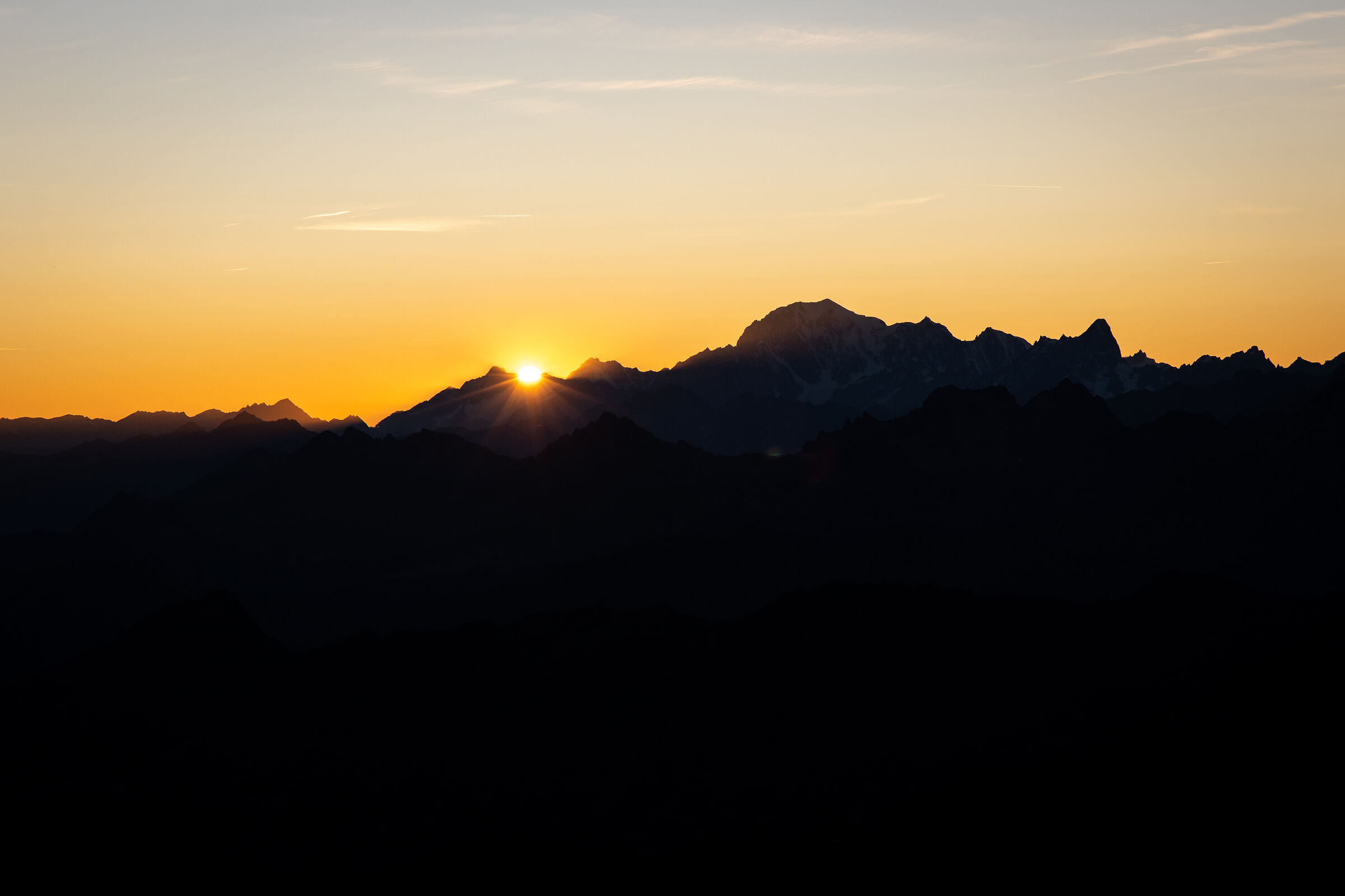 The sun hides behind White