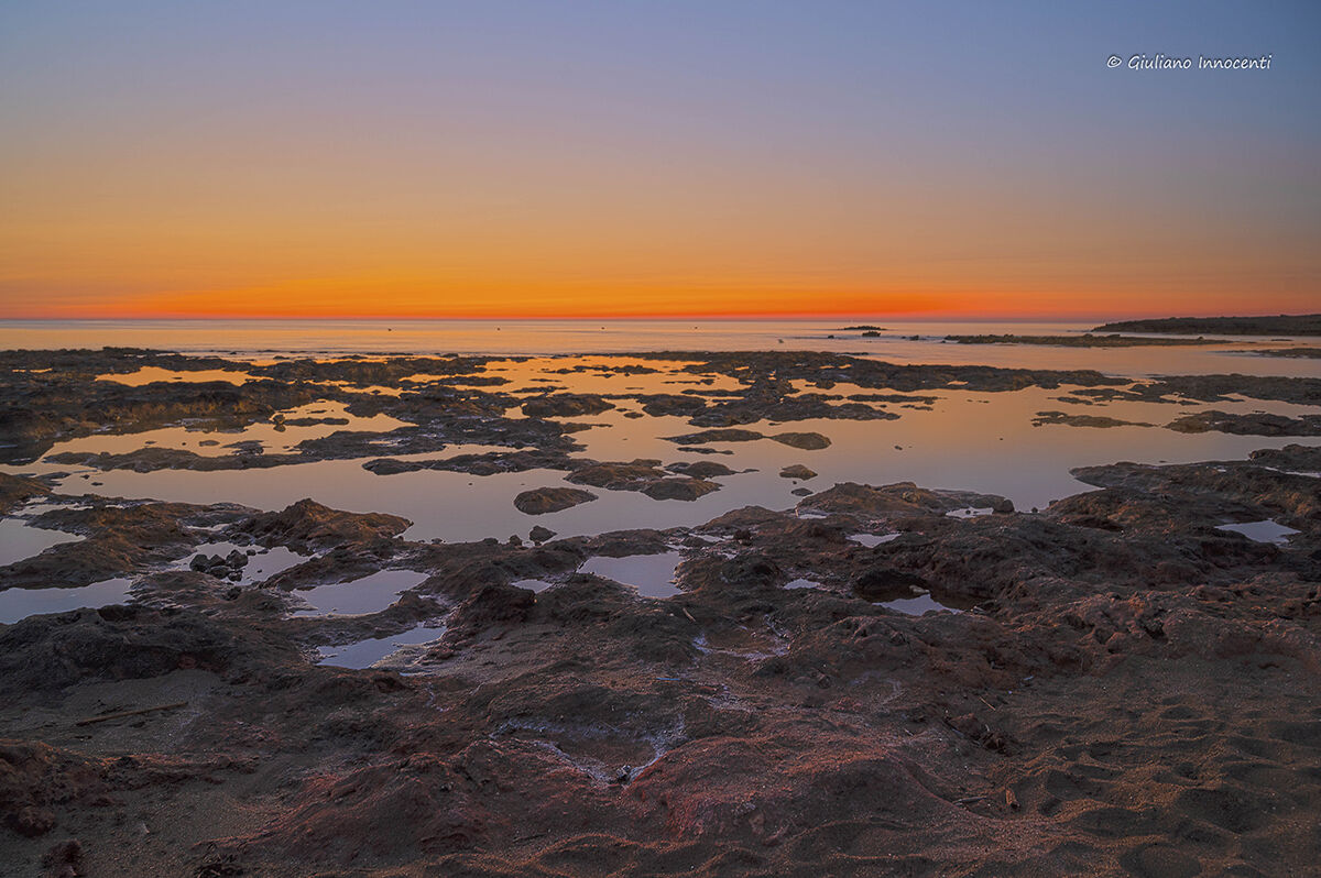 5 am and 3 pm, sunrise on the crenellated coast-Puglia