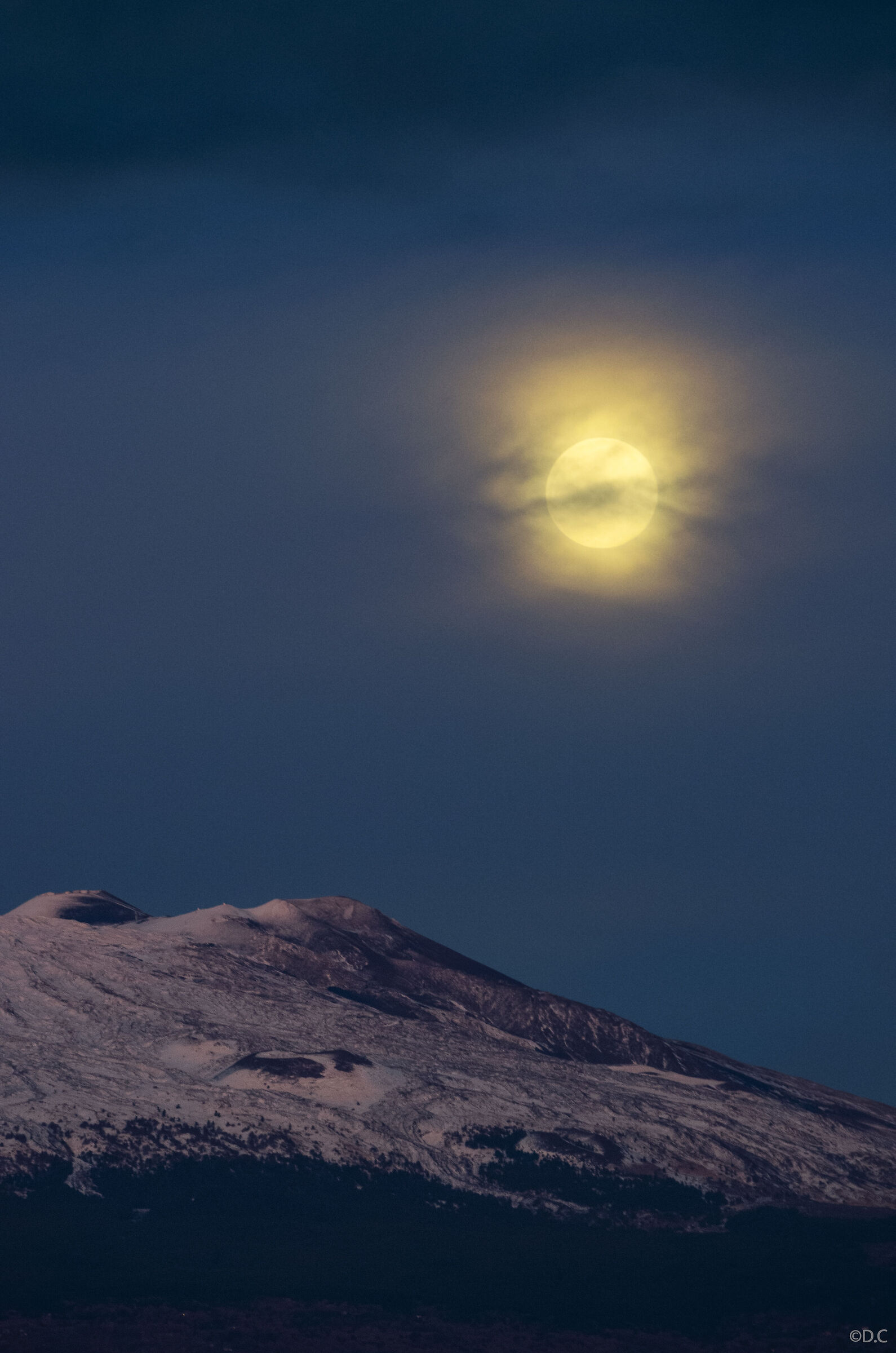 Moon above craters