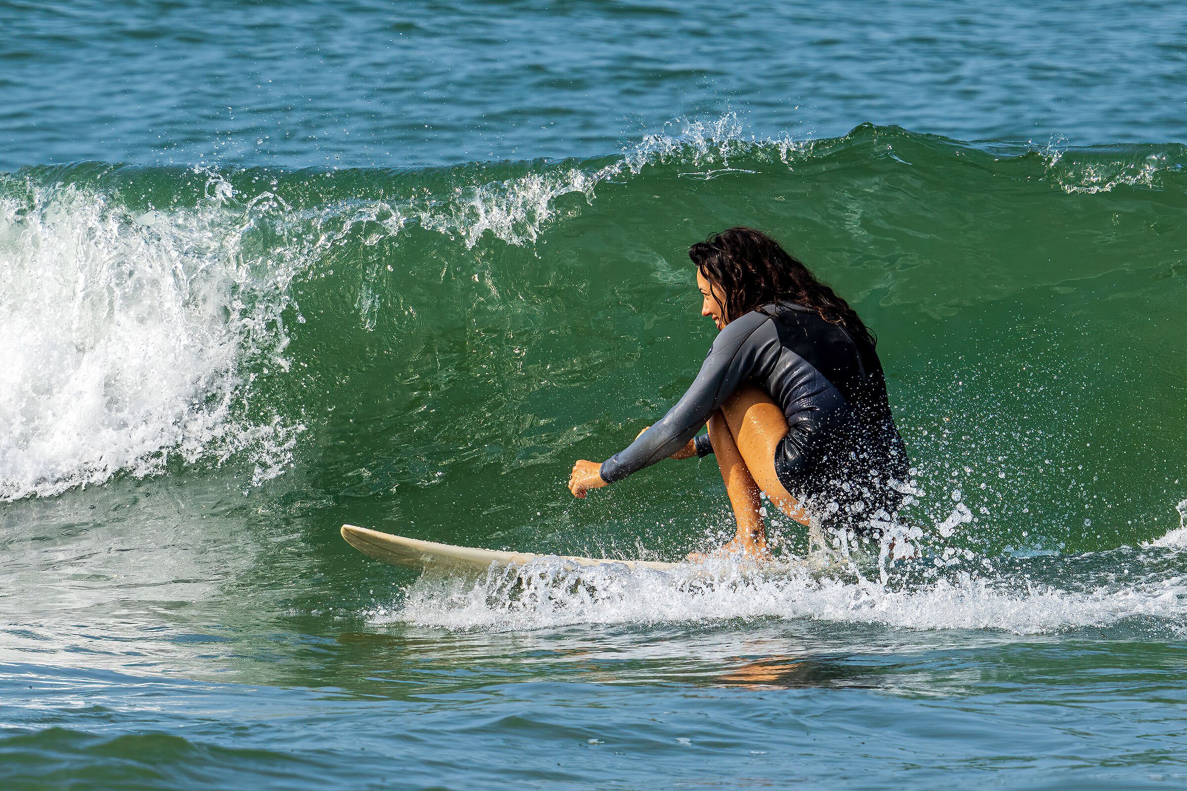 smiling and riding the waves