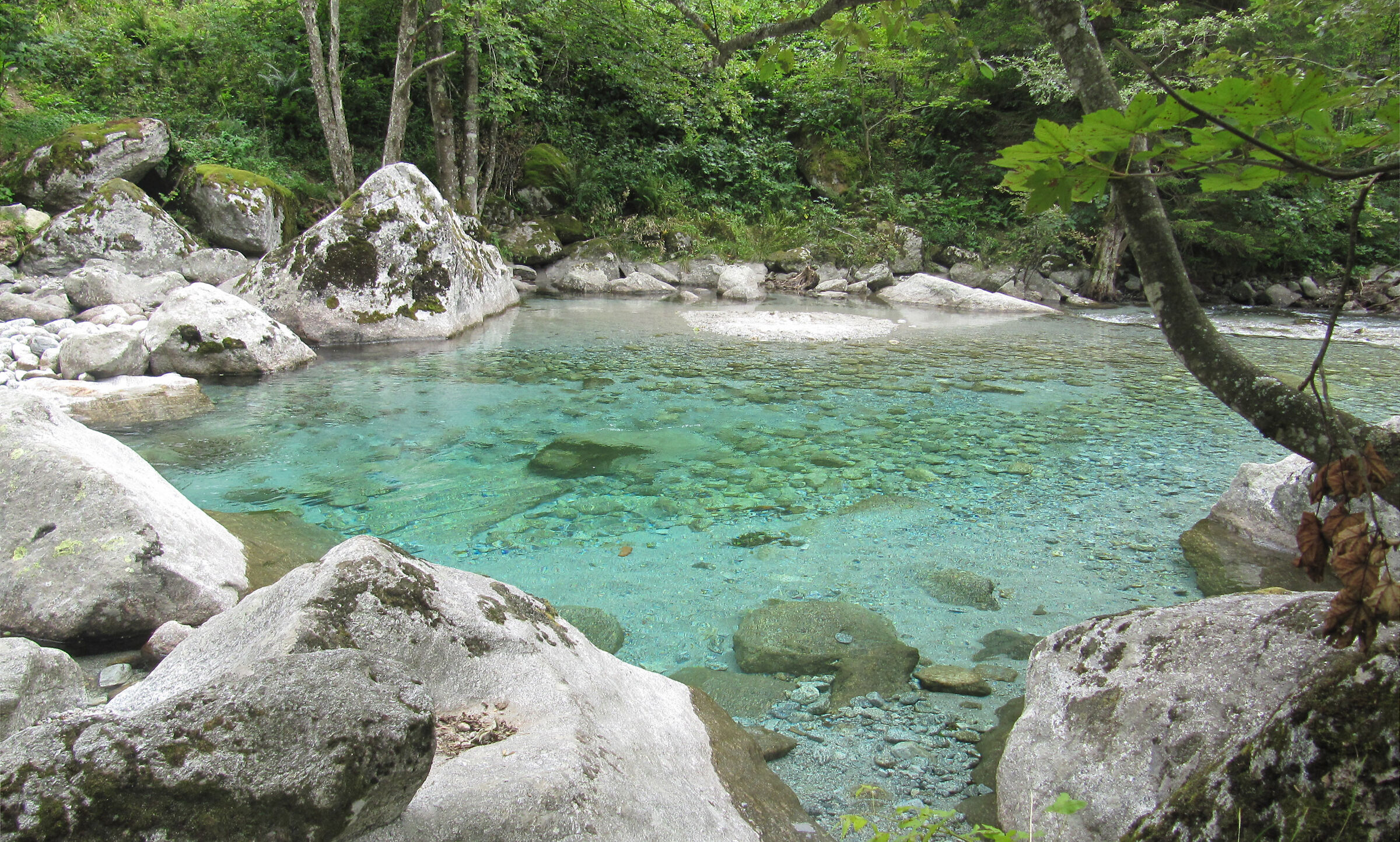 pool of water between the granite rocks