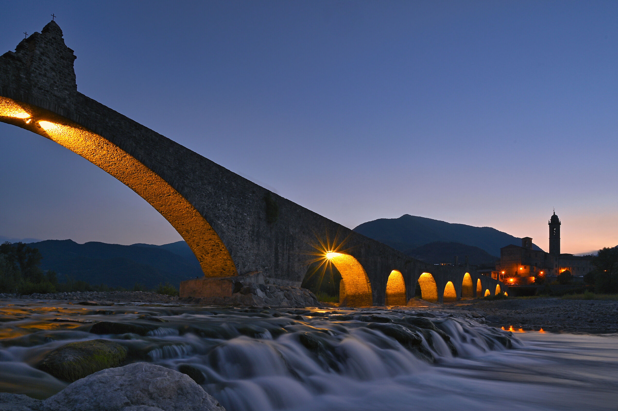 The hunchback bridge of Bobbio at the blue hour