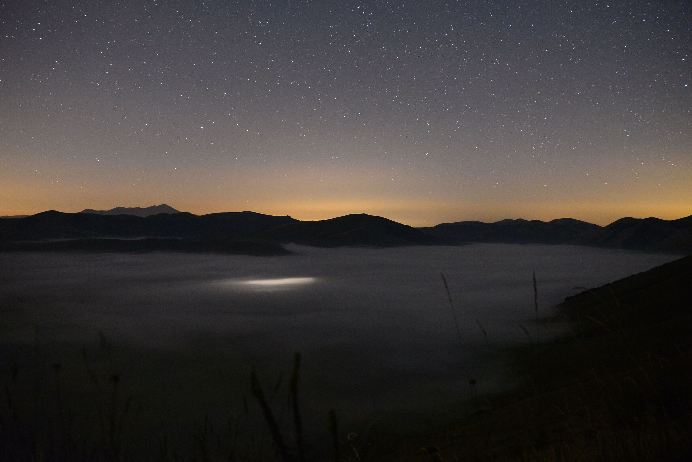 Piana di Castelluccio with Fog and Car in Transit