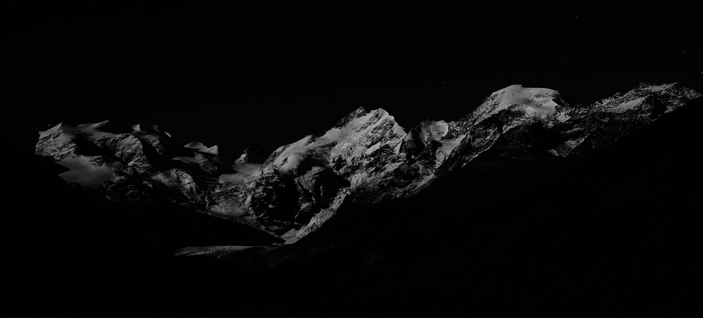 Bernina group illuminated by a full moon