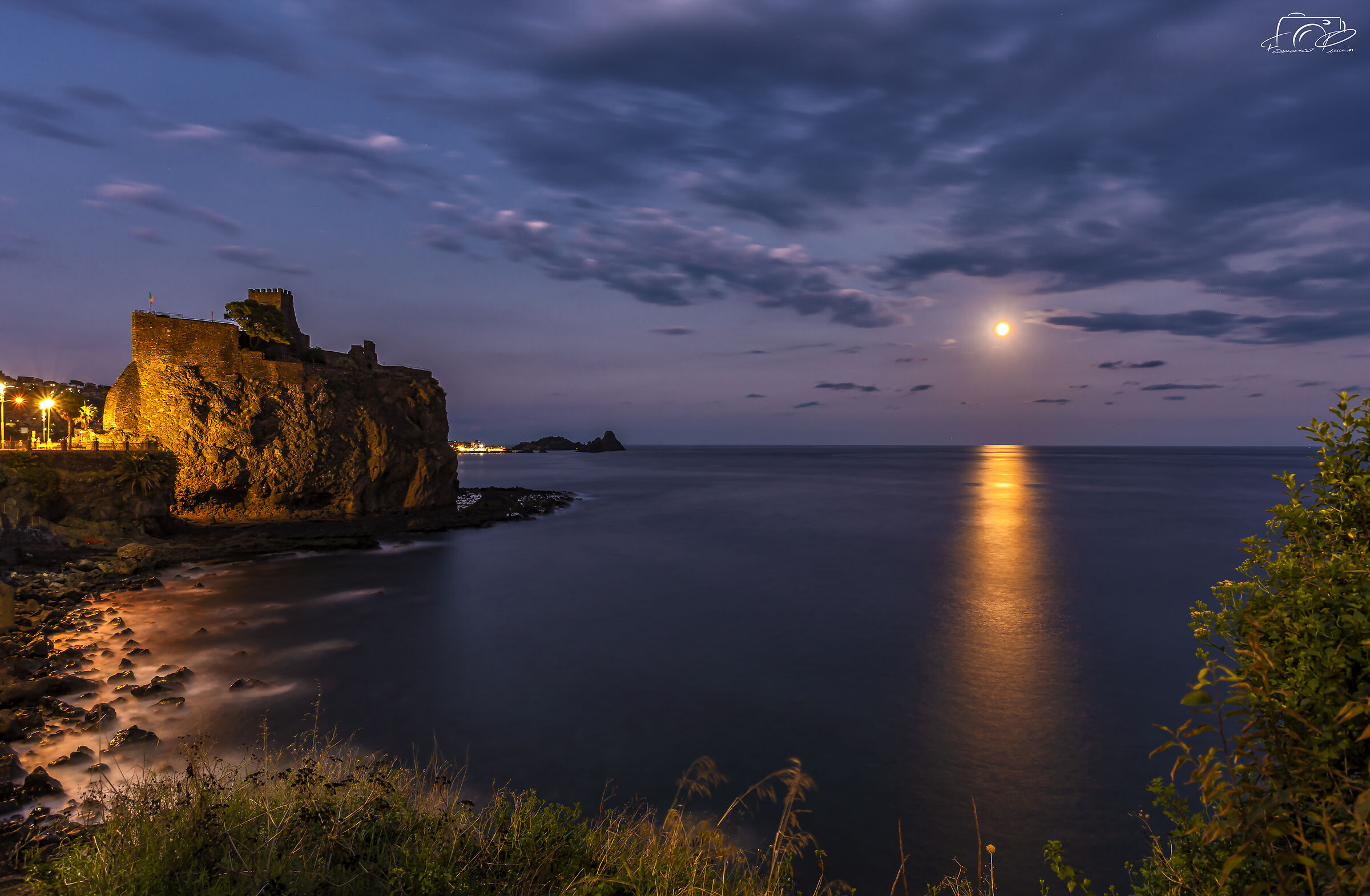 The castle of Aci illuminated by the moon - Aci Castello