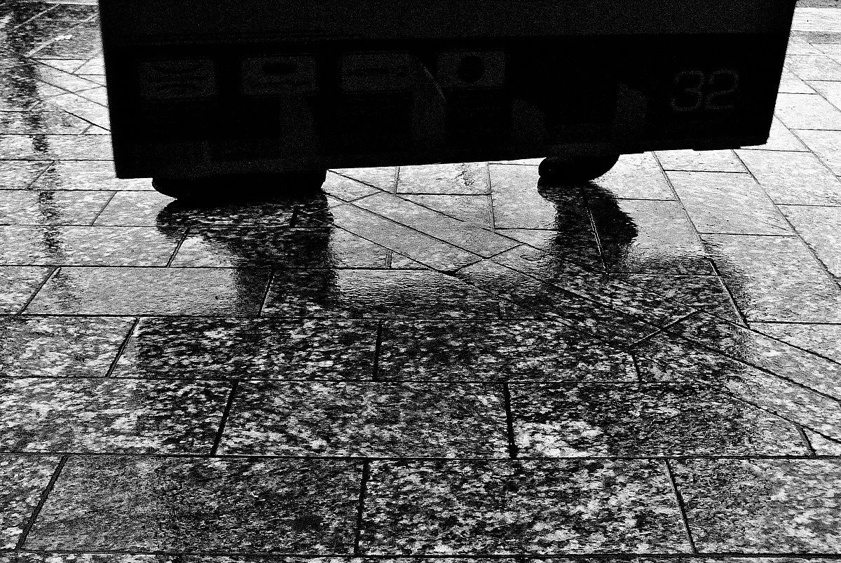 Standing on the wet sidewalk III