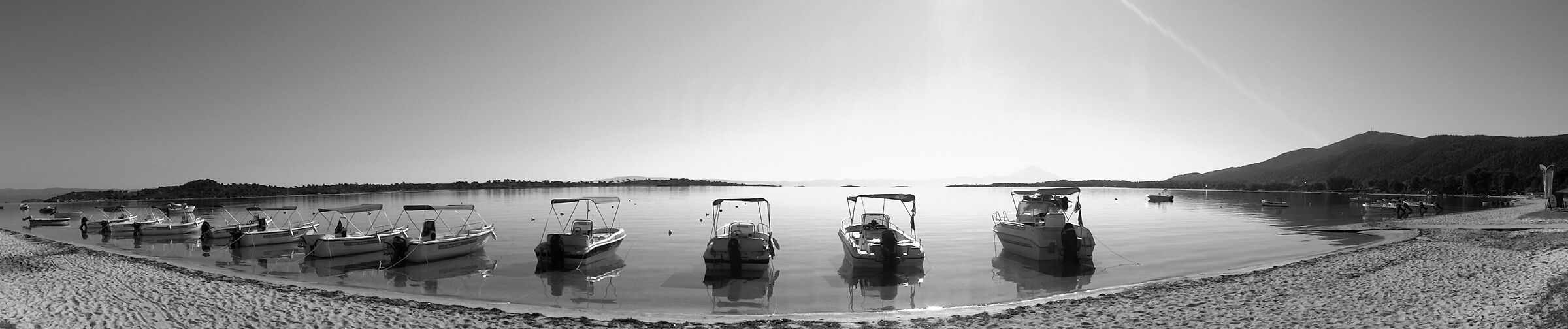 Halkidiki. Tourist boats on the shore.
