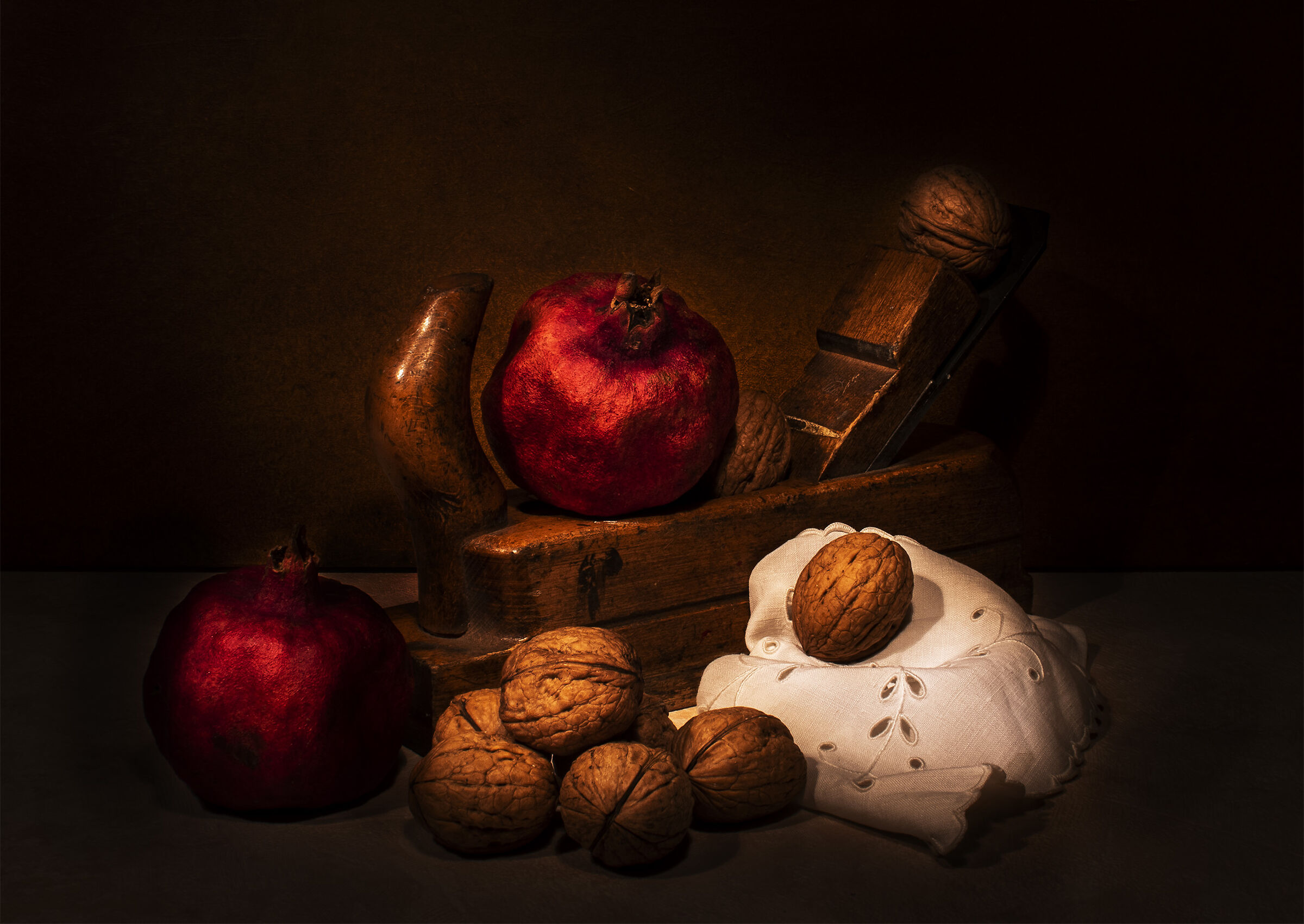 Still life with nuts and pomegranates