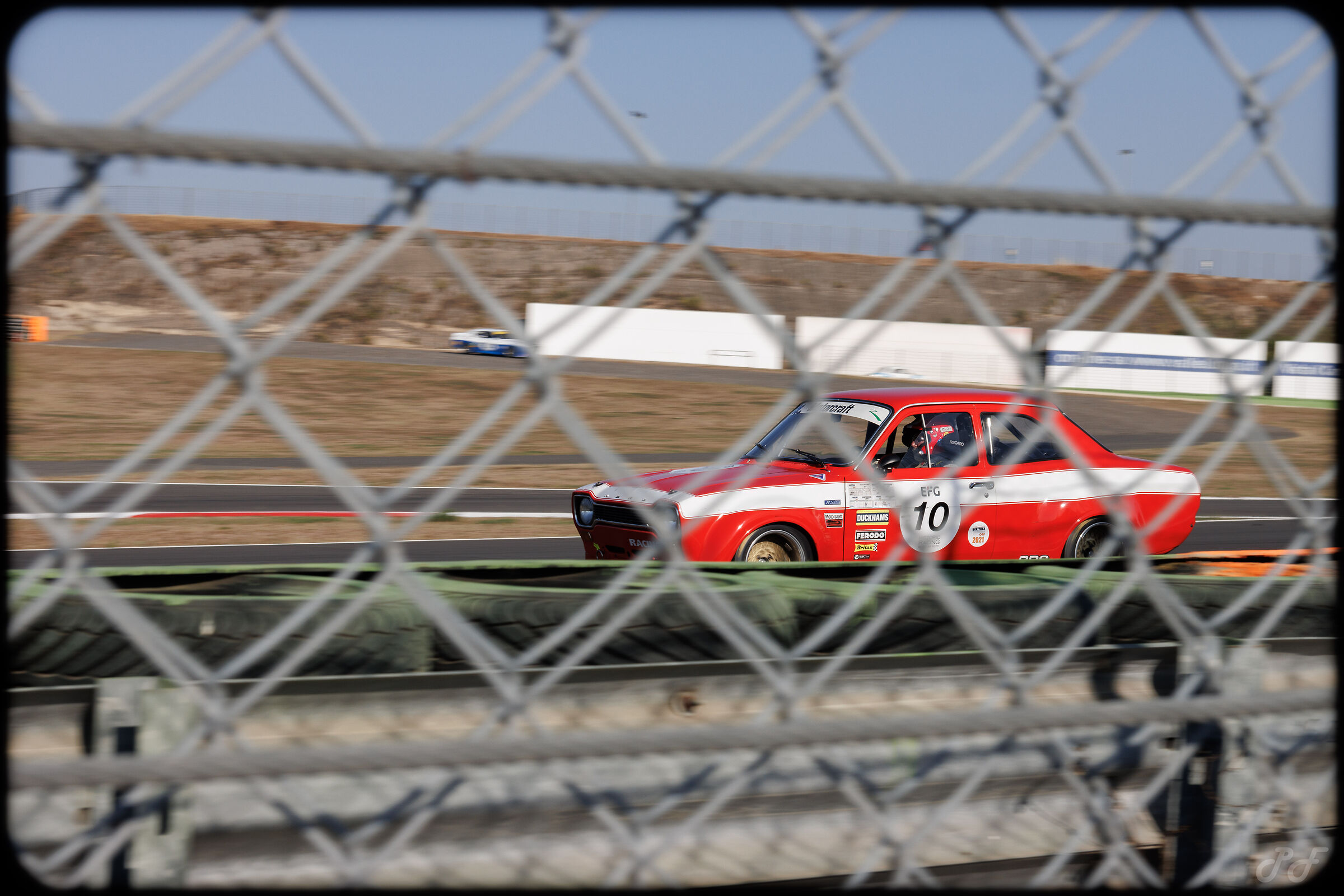 From behind the barrier