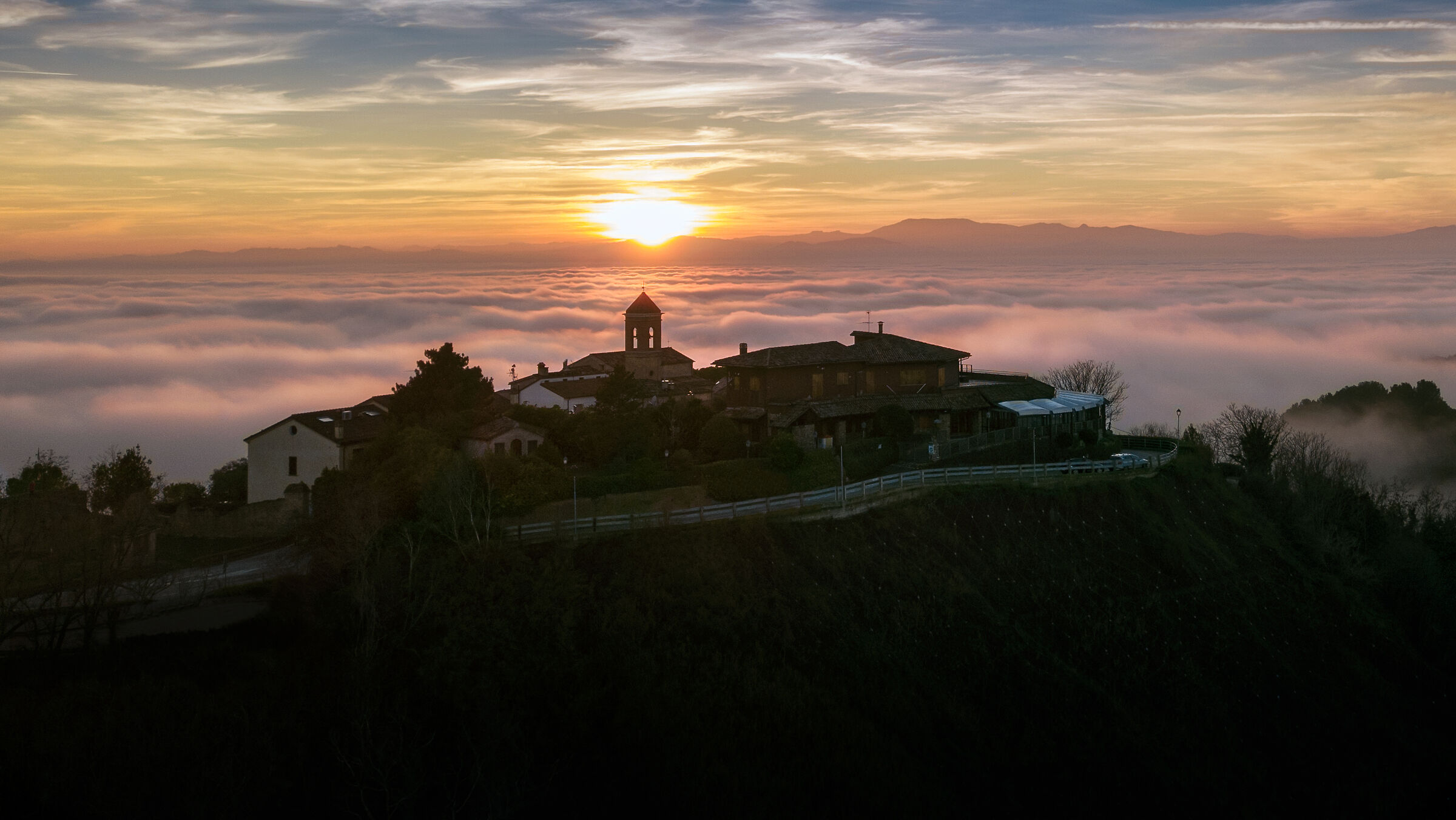 Village at sunset with Fog
