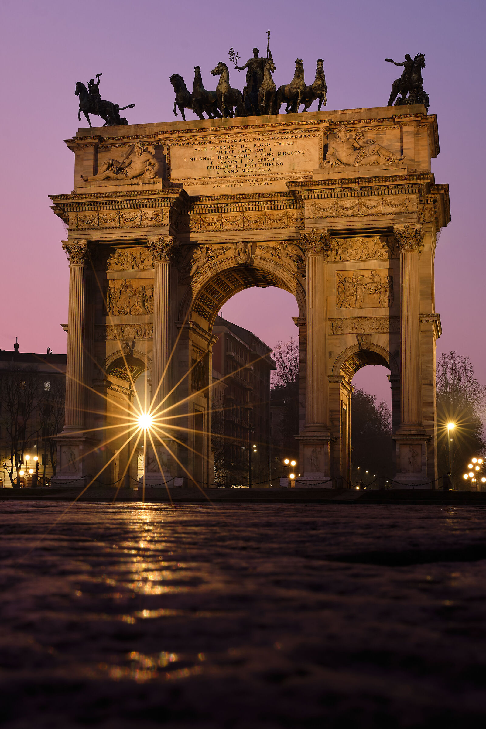 Poised between the colors of the sunset and the lights of th...