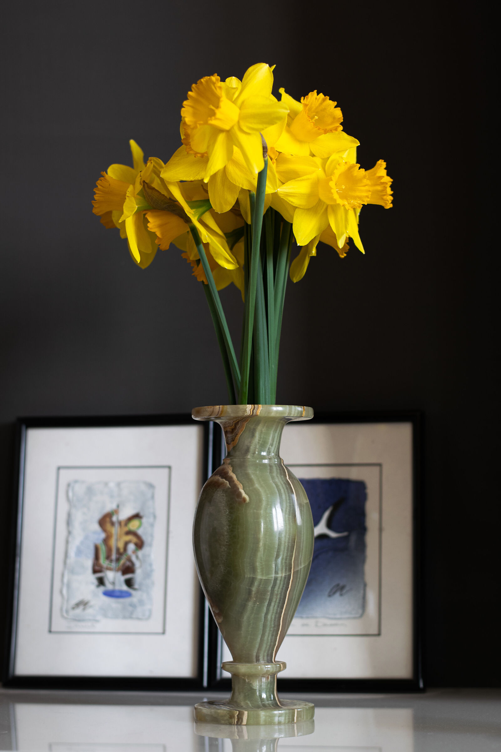 green vase, yellow flowers