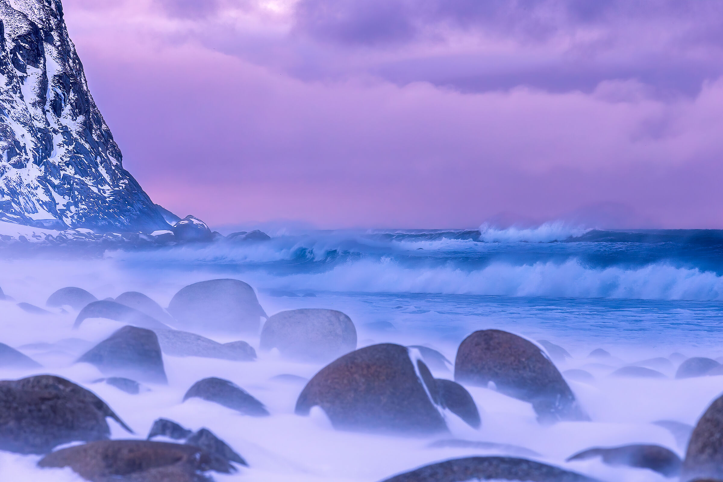 Windy and snowy sunset at Unstad Artic beach