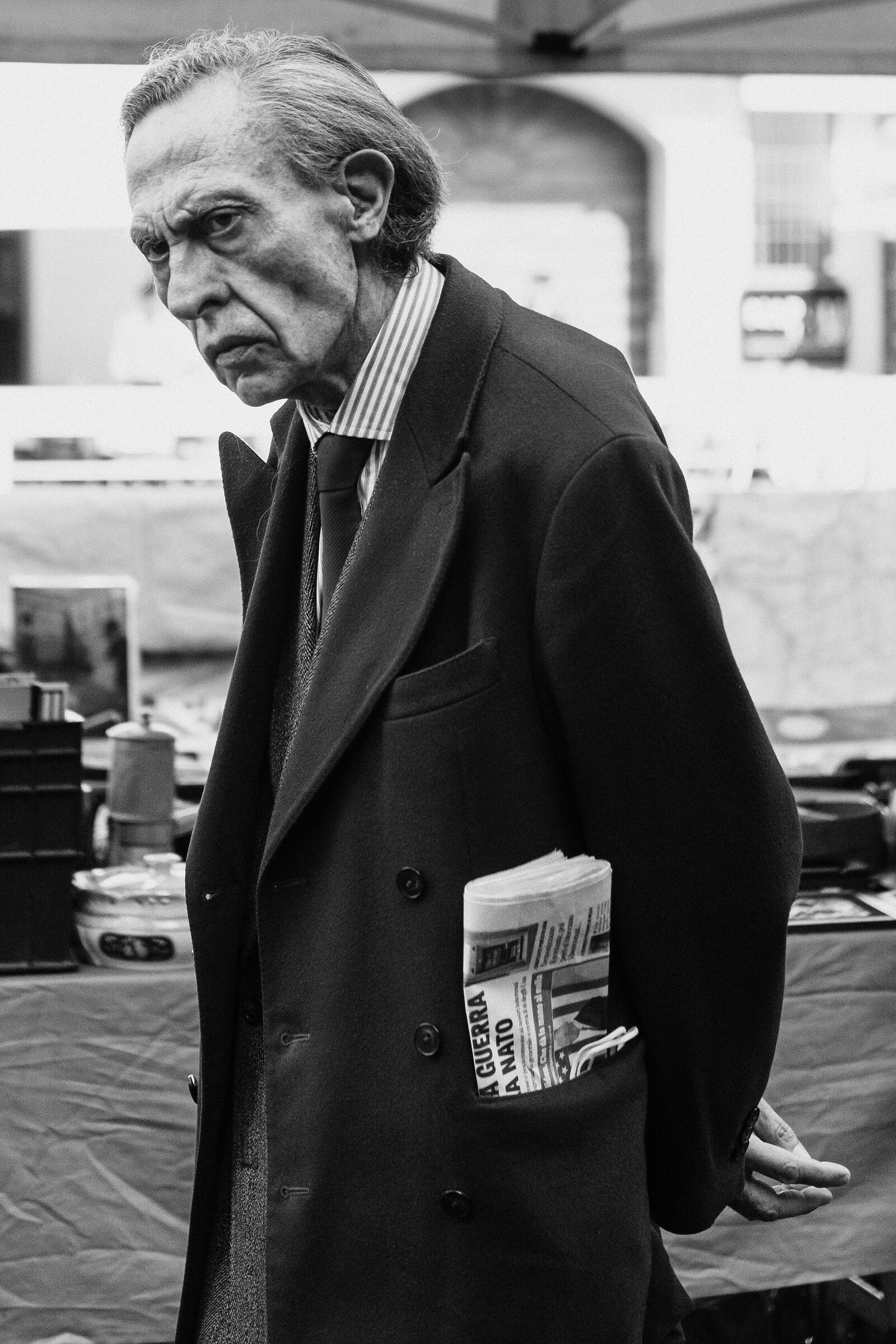 evil man plotting at sinigaglia market