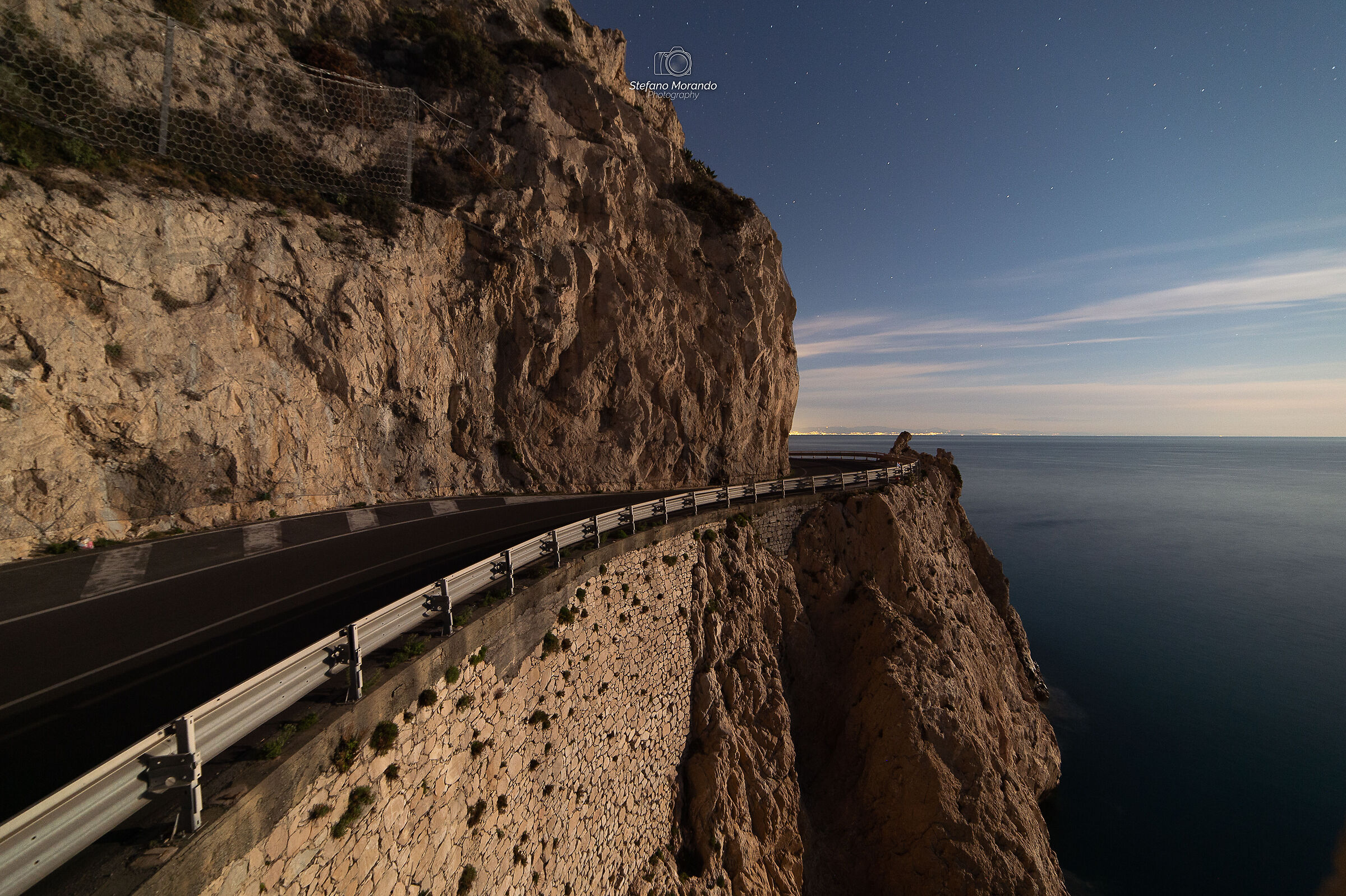 The Moon illuminates Capo Noli