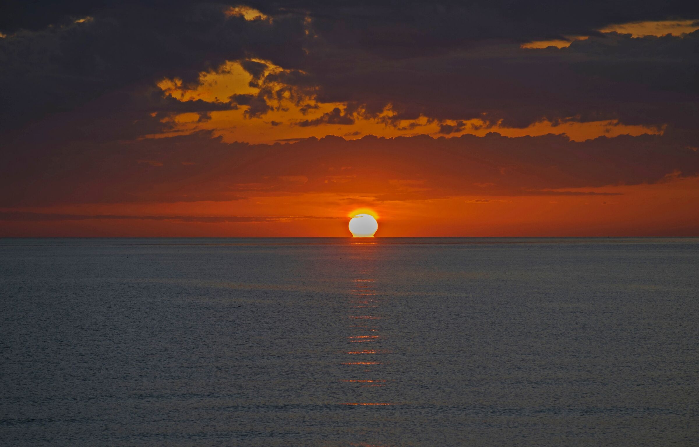 The sun... wins on the clouds