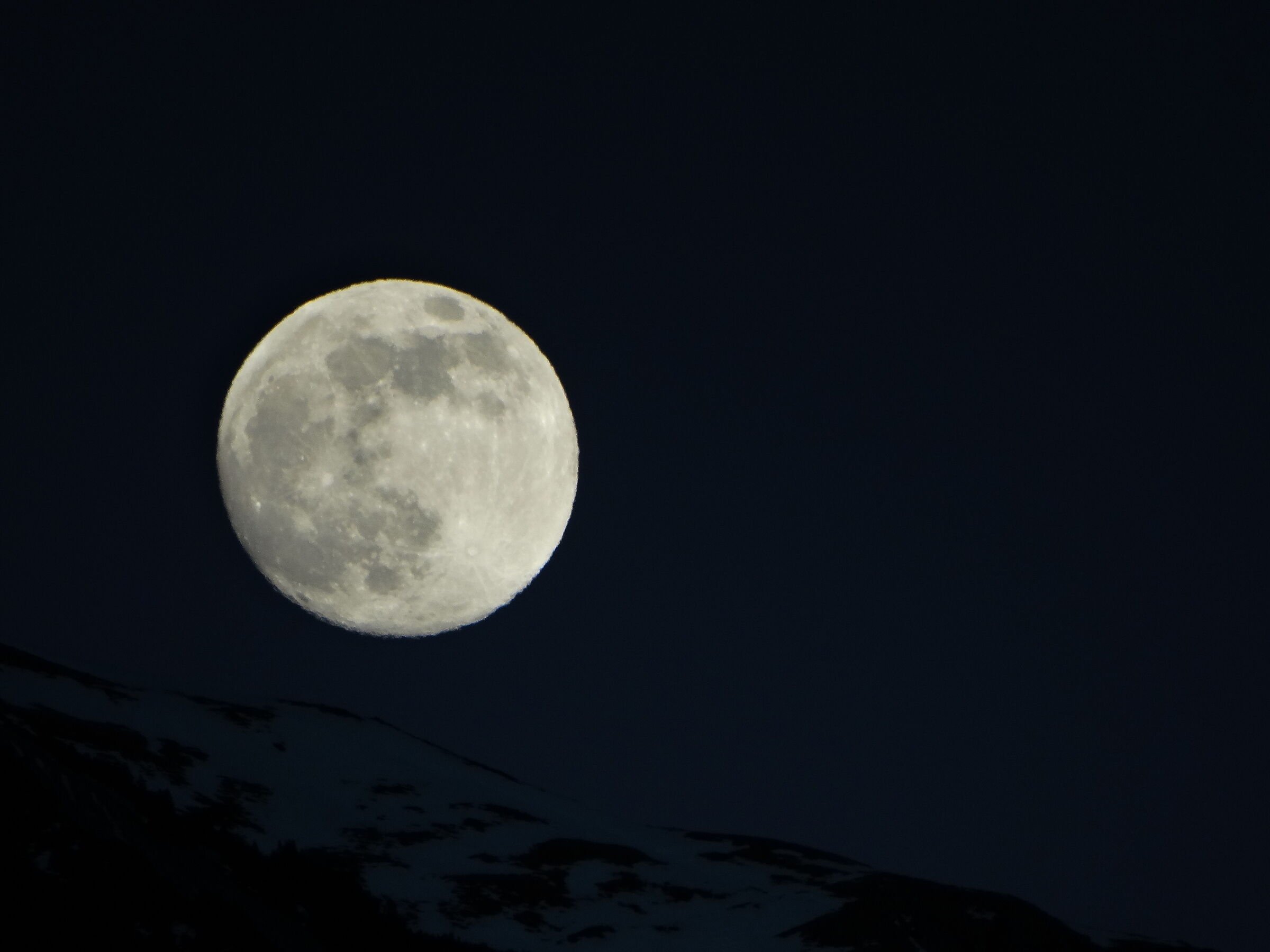 The Moon appears from the mountain