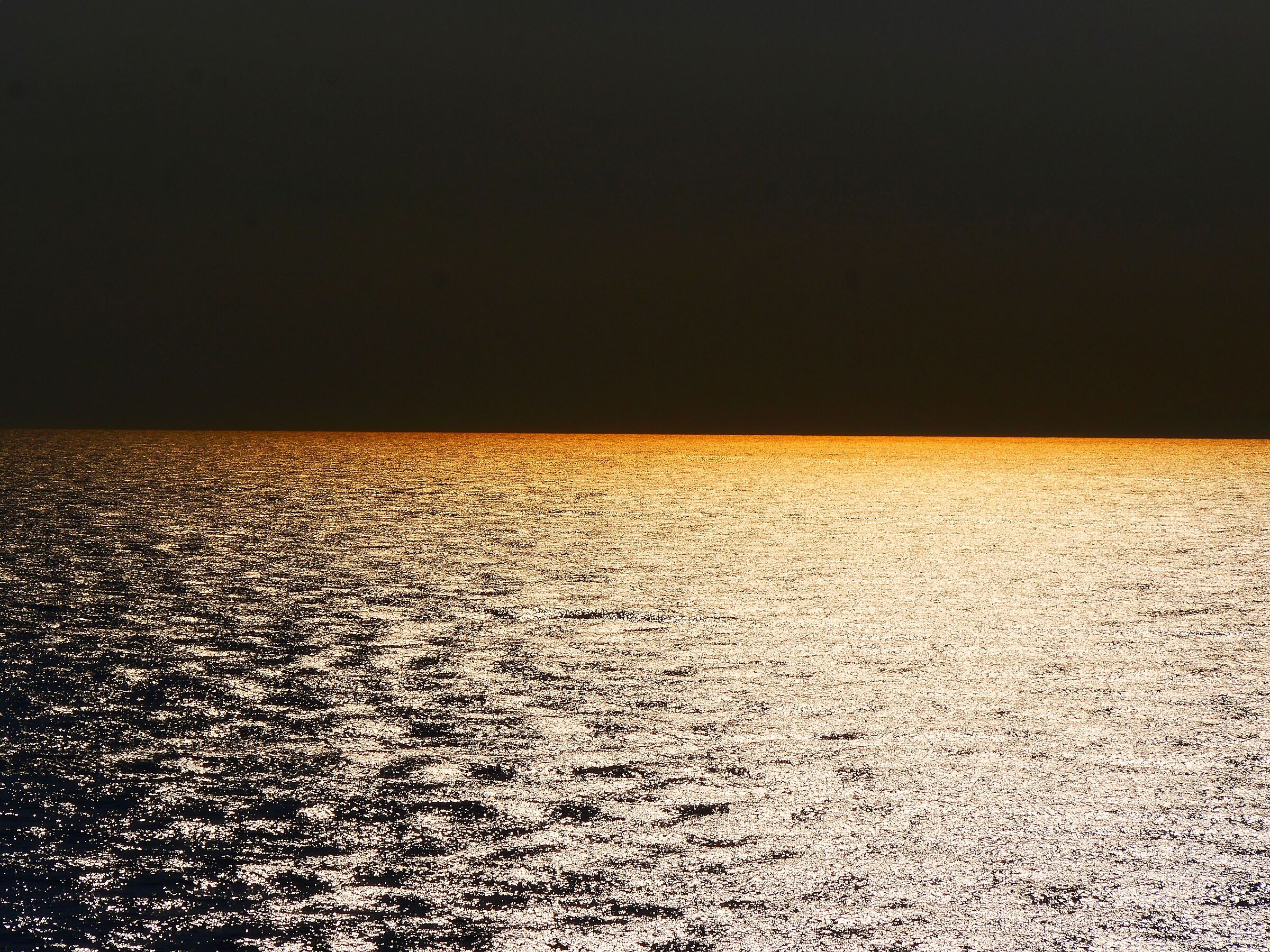 Here where the sea glitters