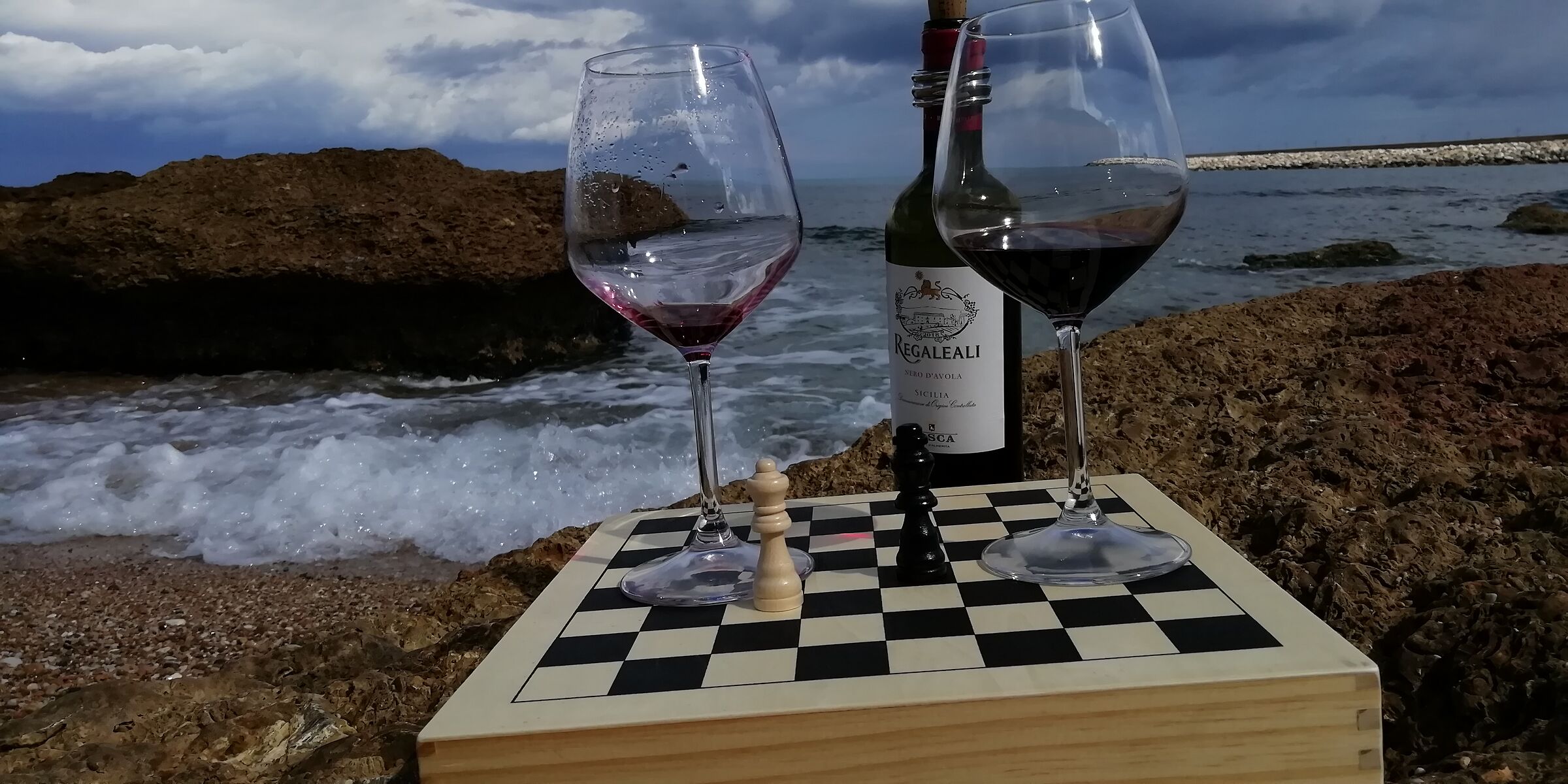 Chess, wine and sea.
