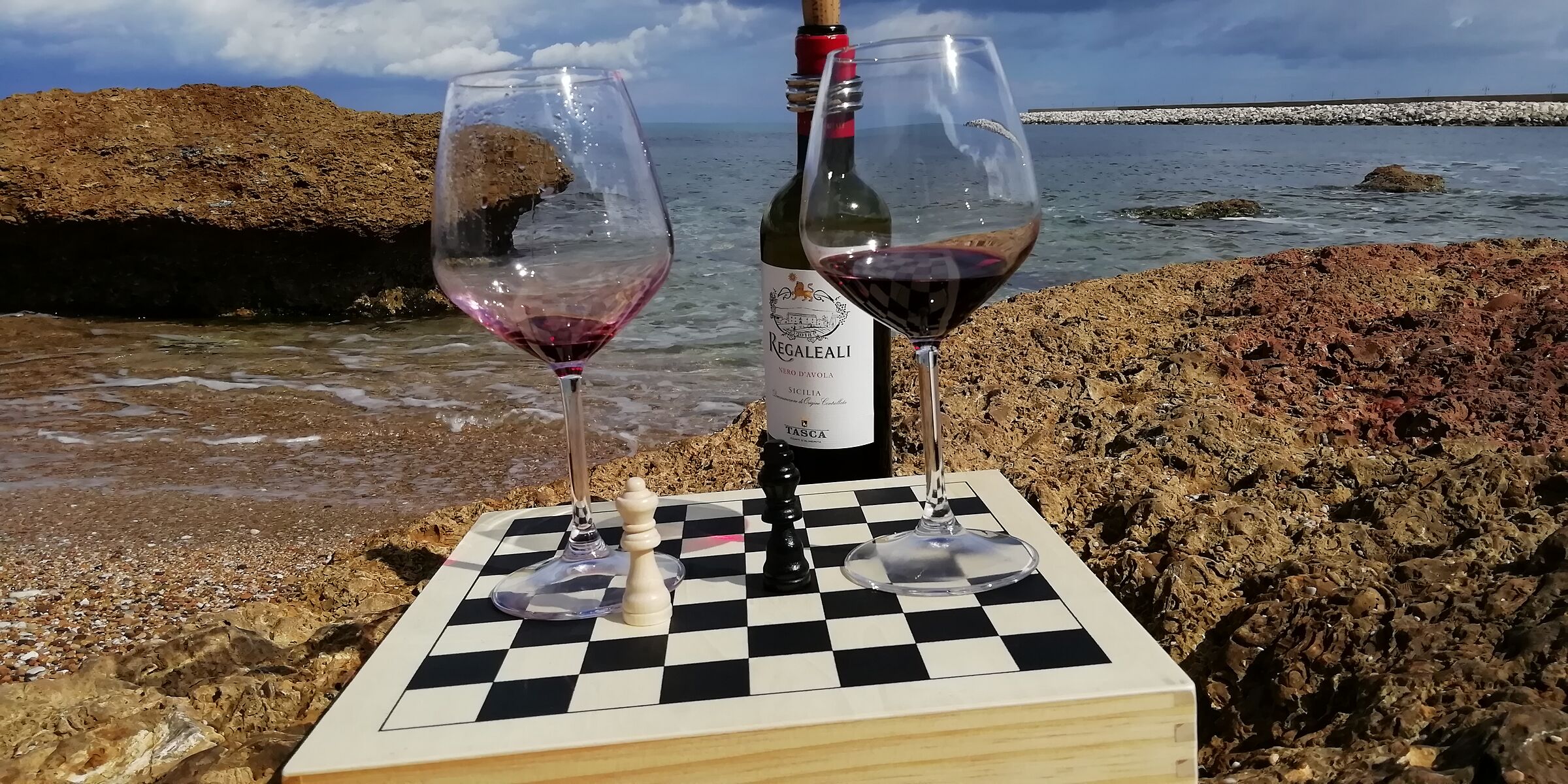Chess, wine and sea.
