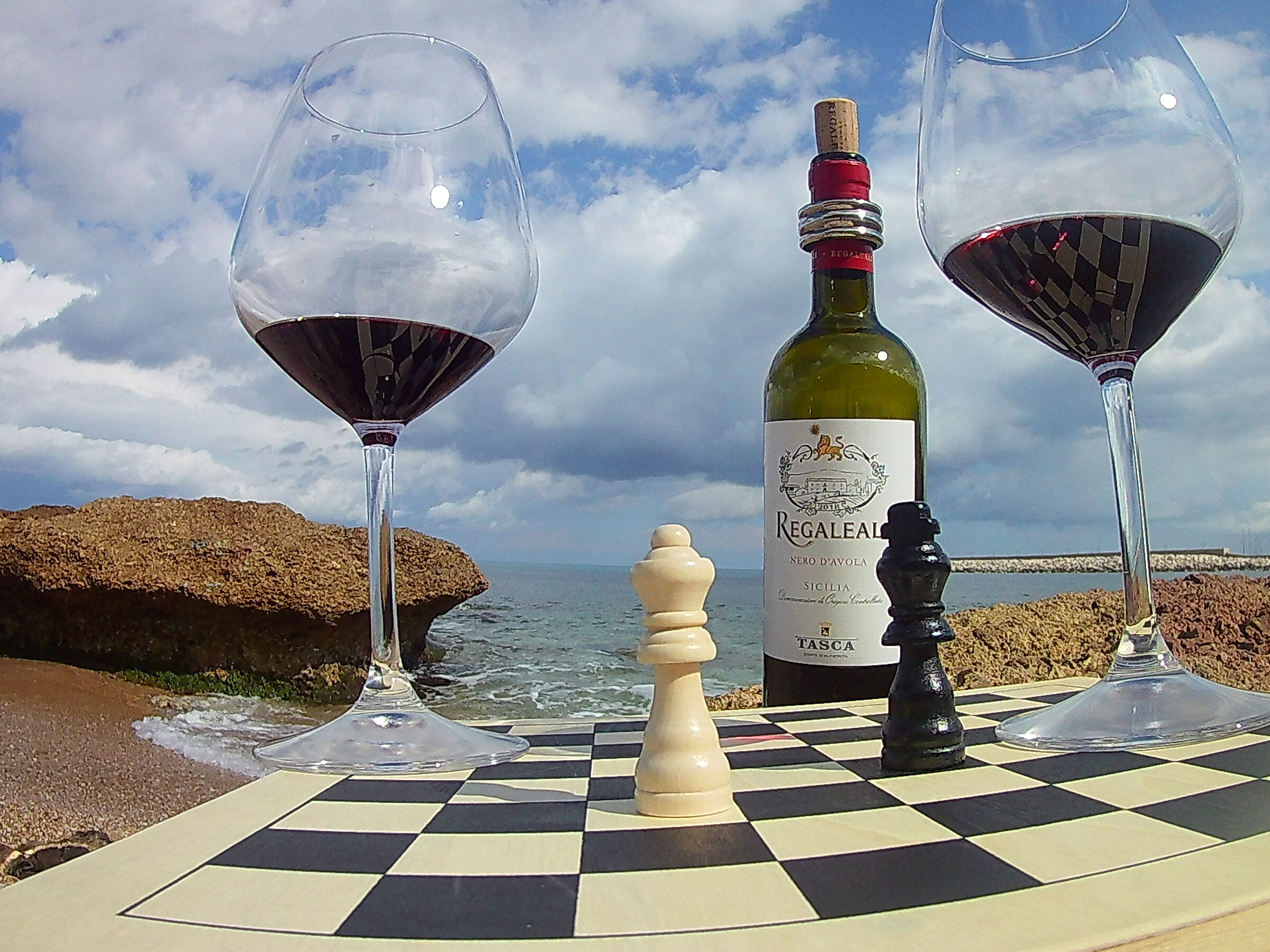 Chess, wine and sea.