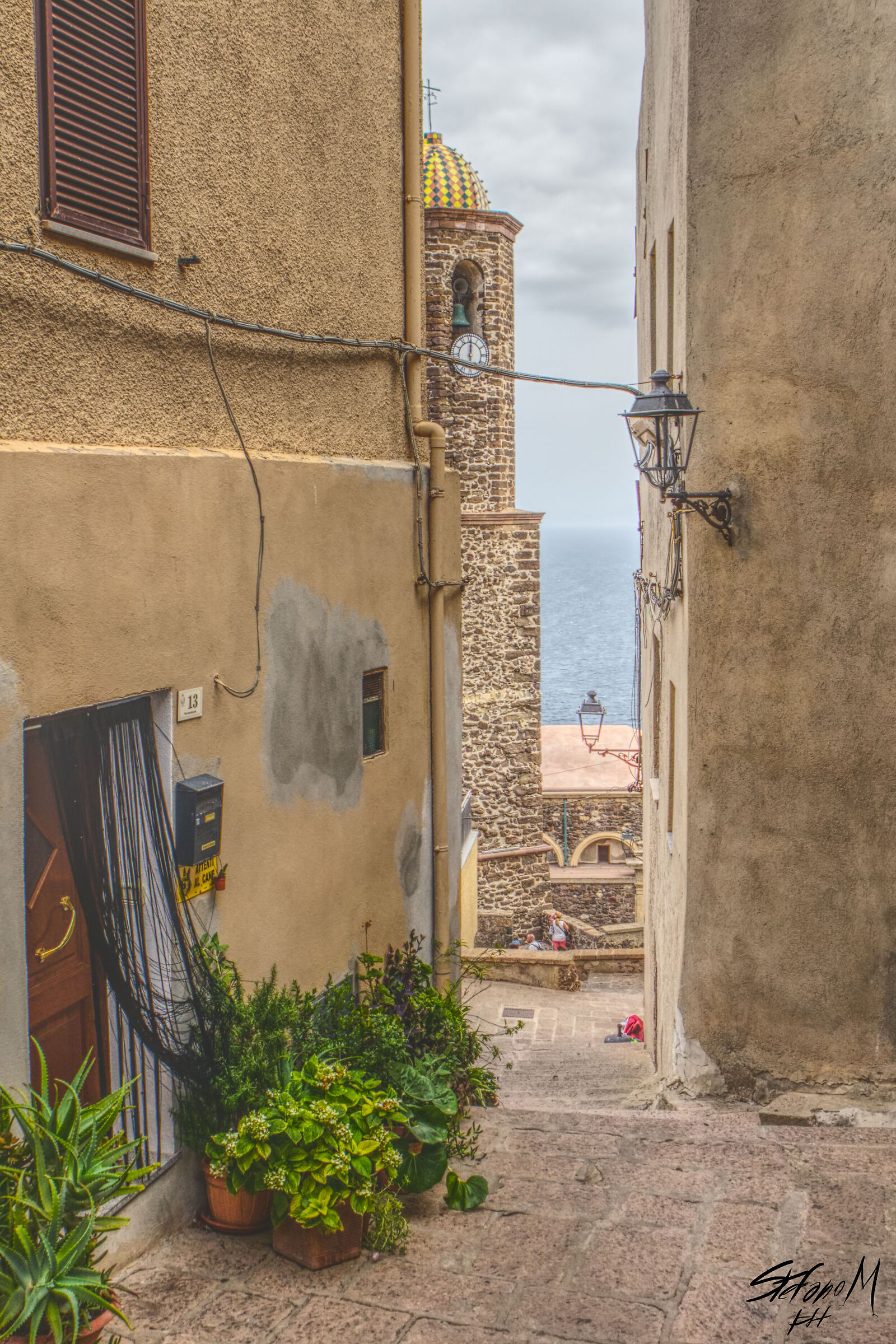 An alley of Castelsardo overlooking the sea. Hdr