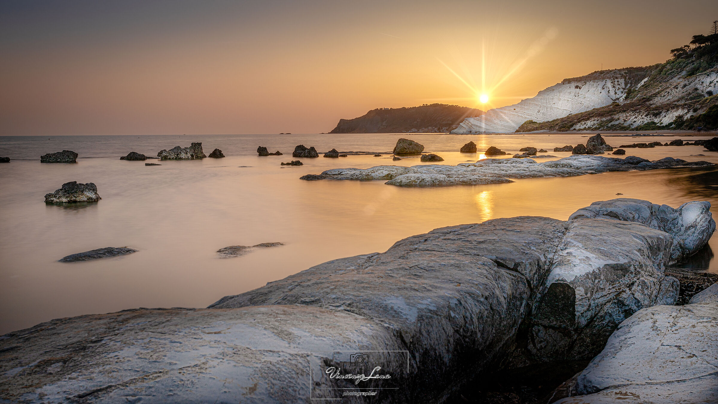 Bacio tra sole,terra e mare