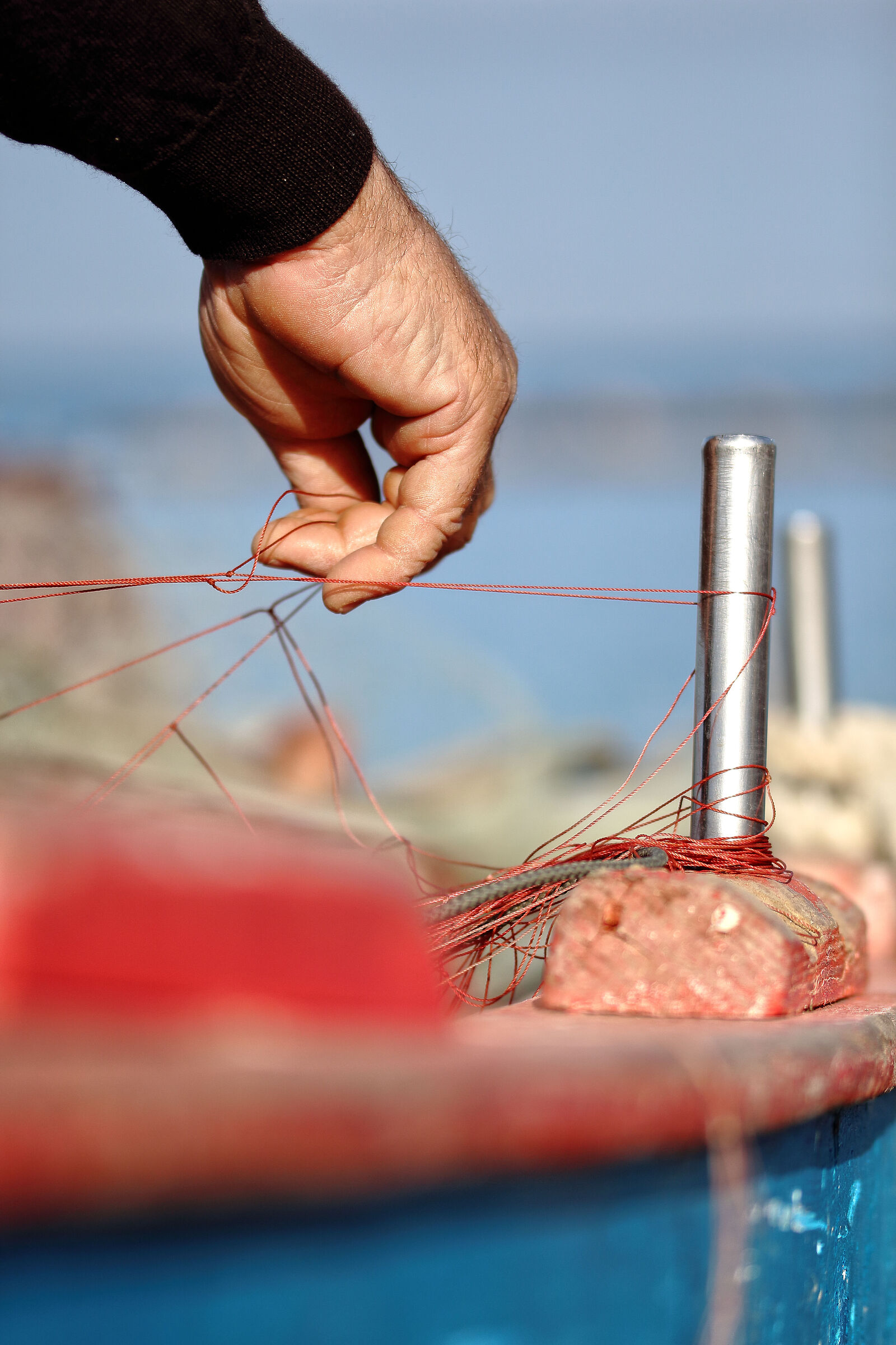 The Fisherman repairing his nets