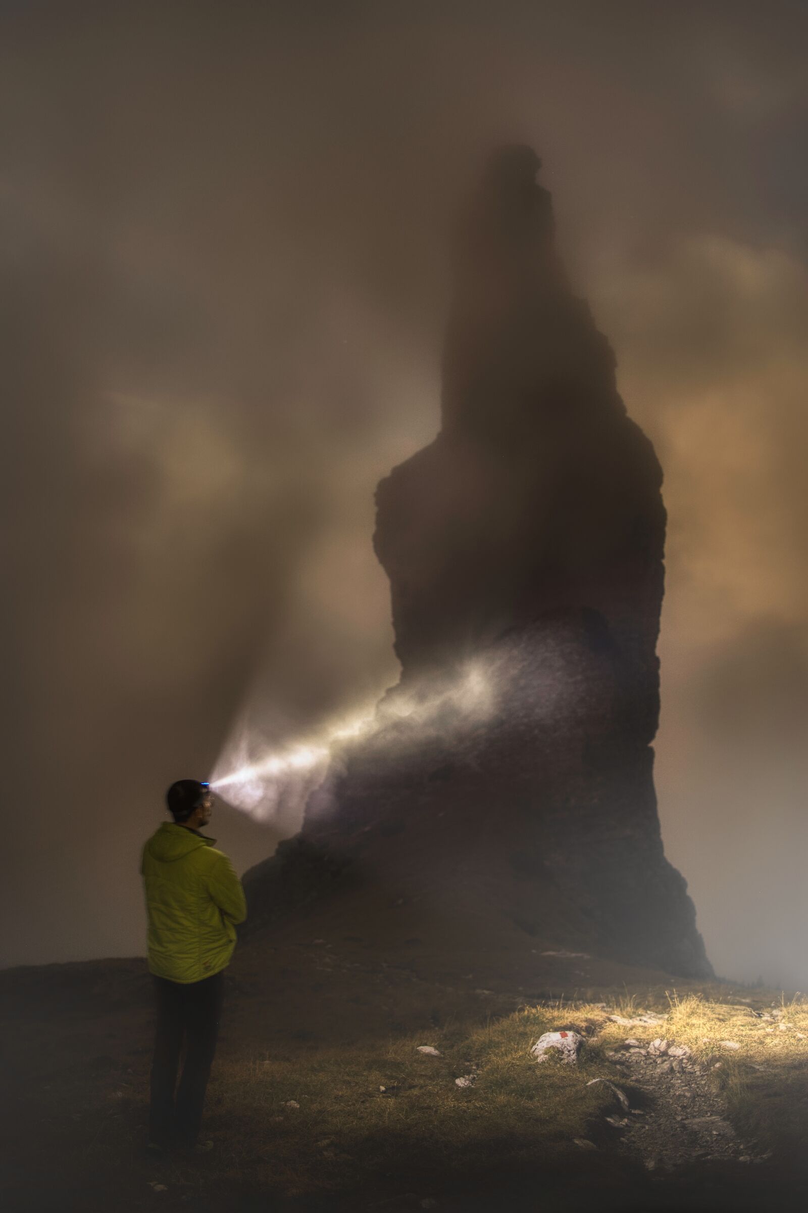 Bell tower of Val Montanaia in the fog