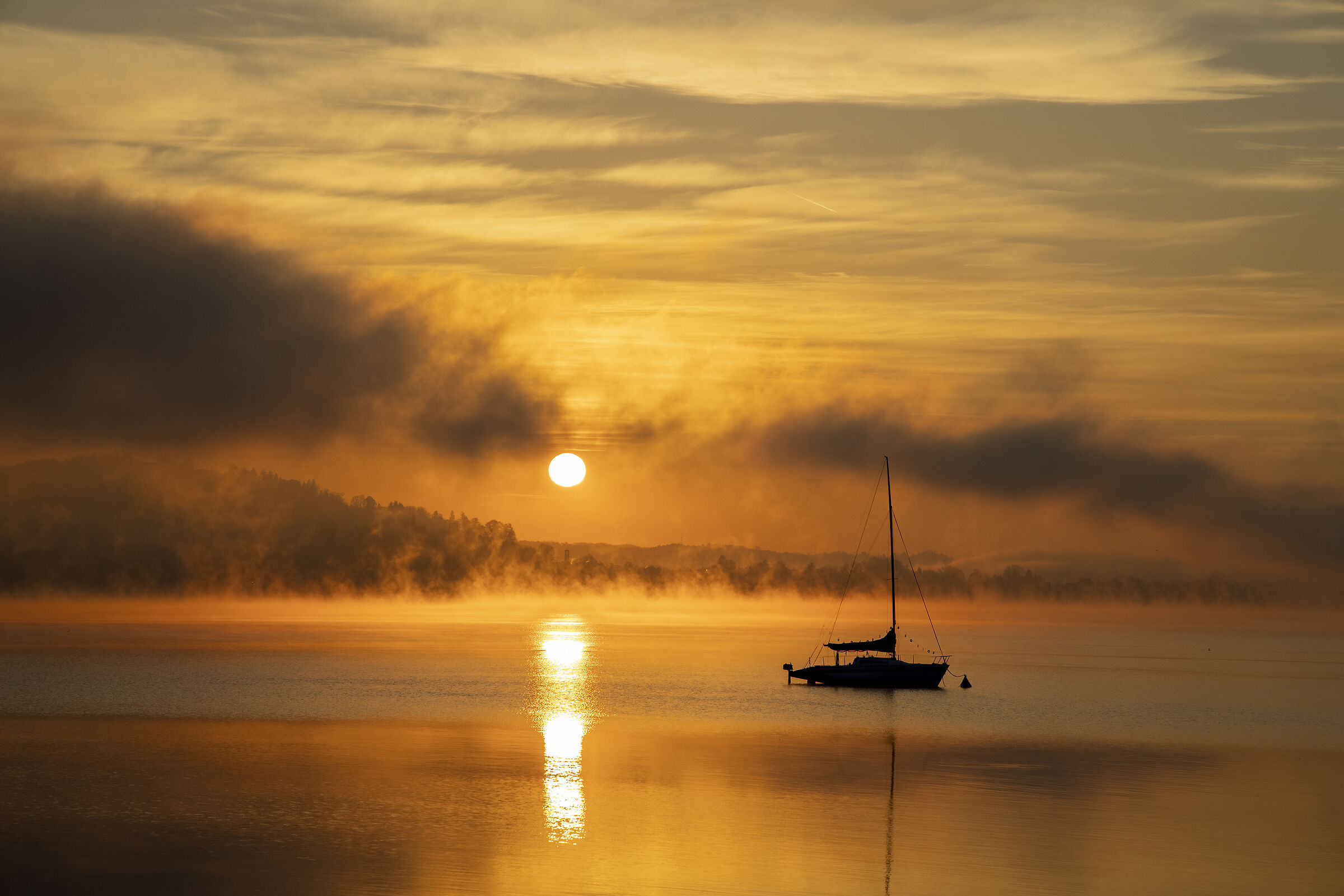 Arona, golden sunrise over Lake Maggiore