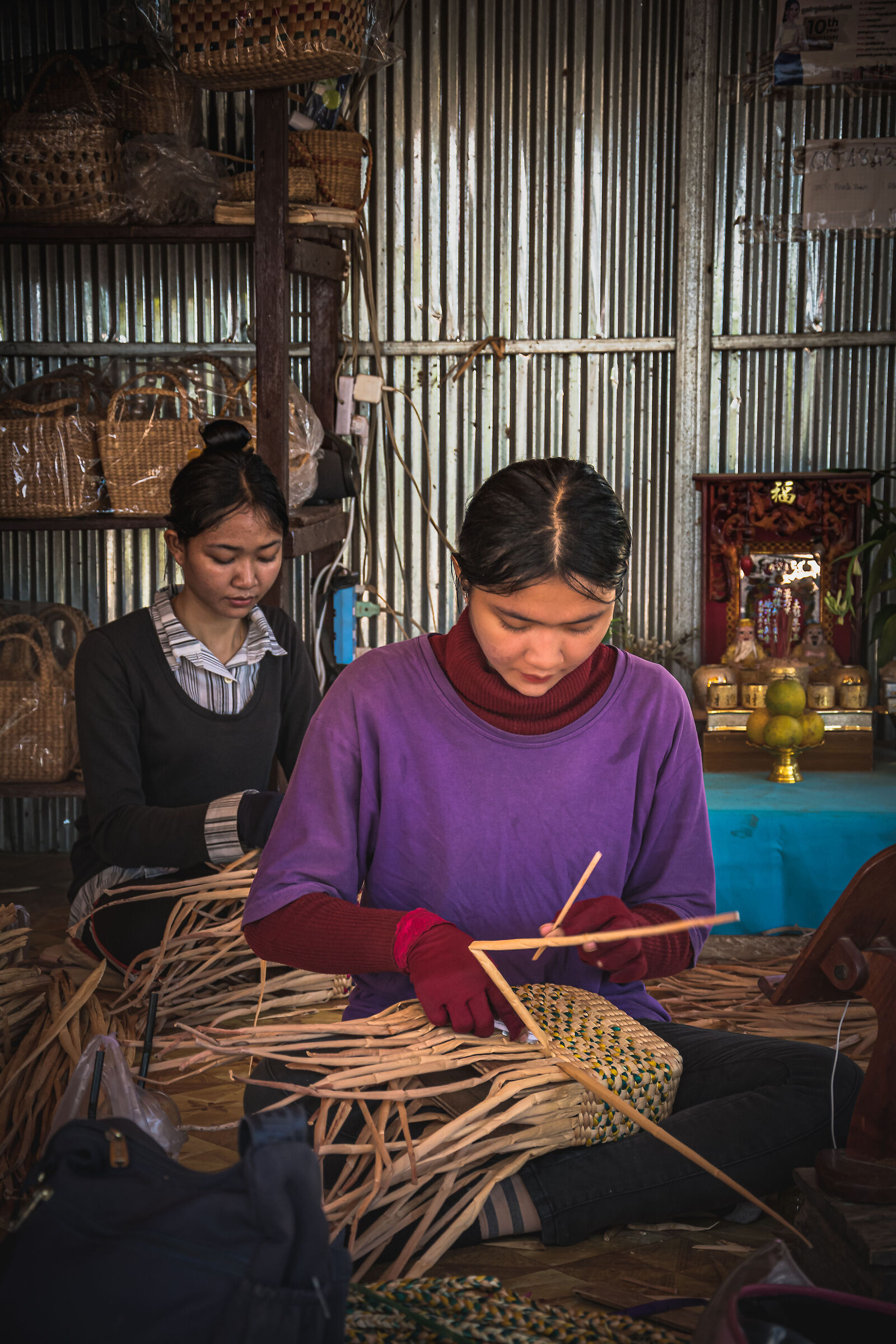 Woman weaving dried plants 1