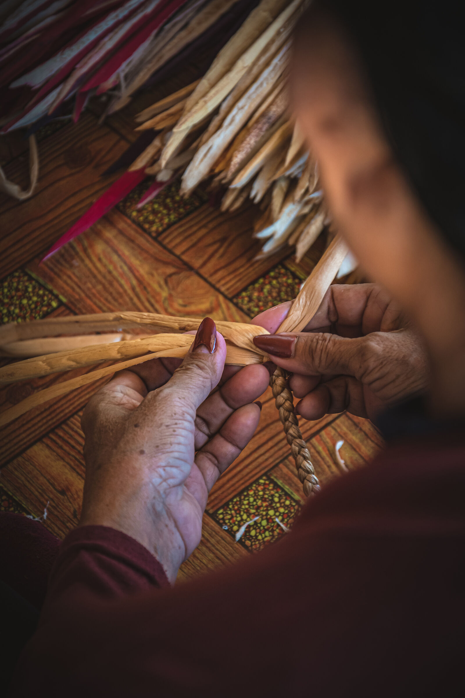 Woman weaving dried plants 3