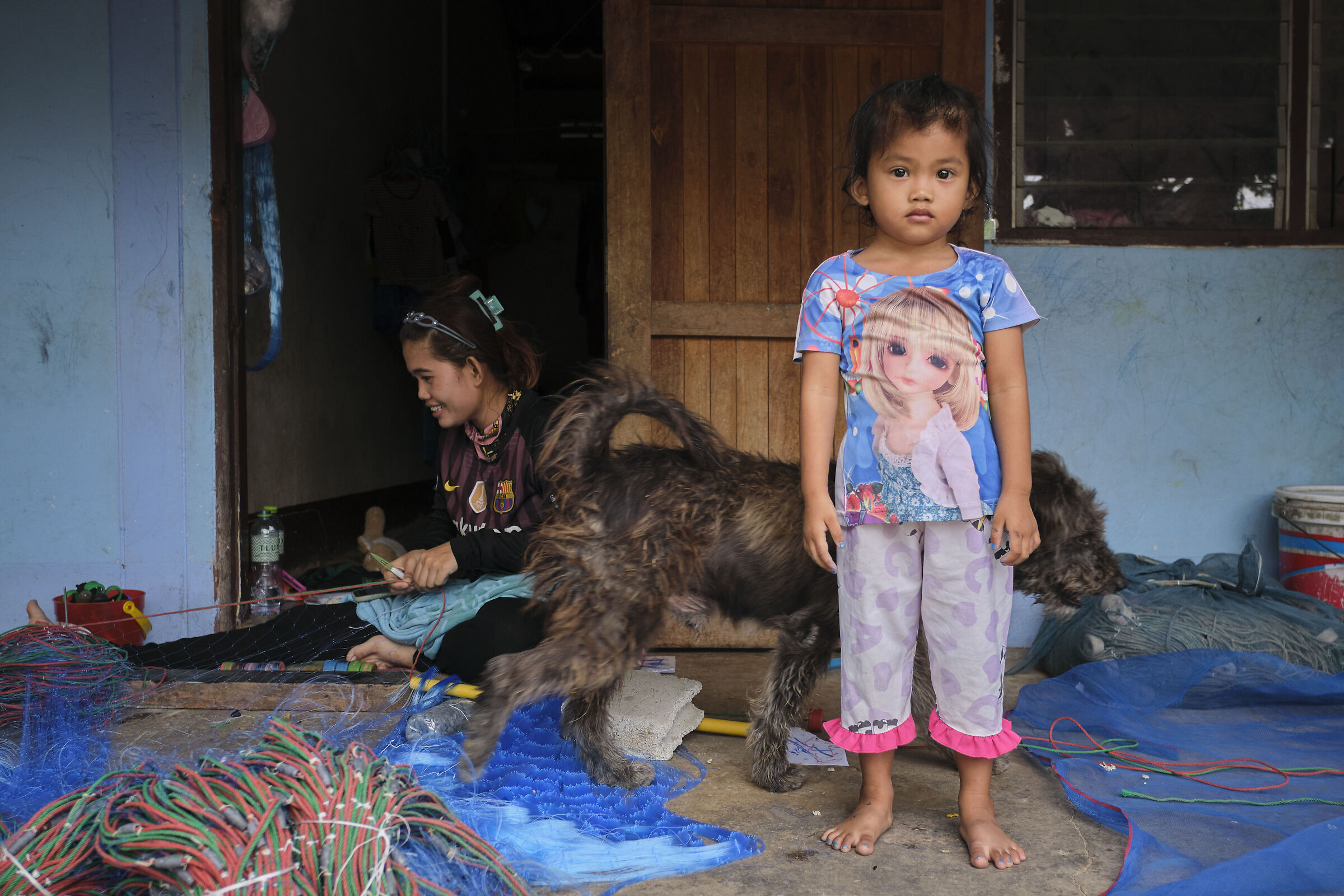 A little girl, a dog, a smile.