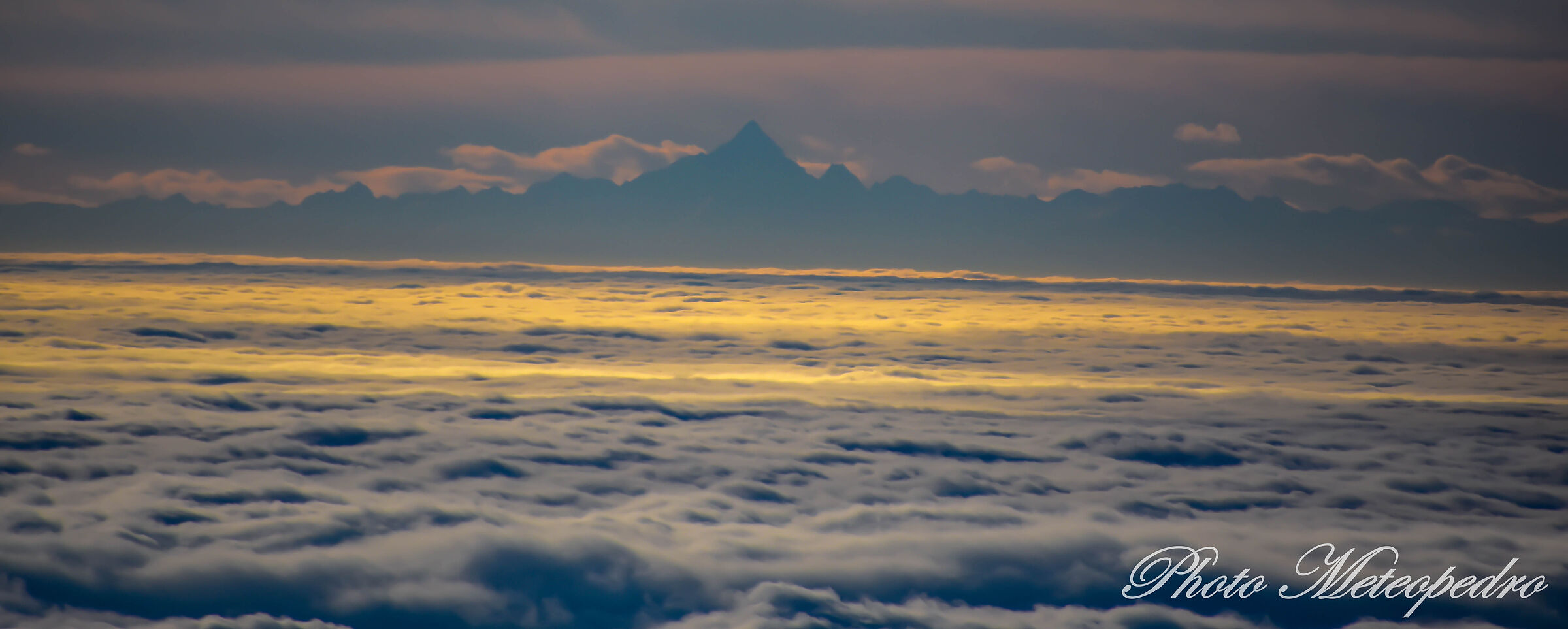 the Monviso at twilight, in a sea of clouds